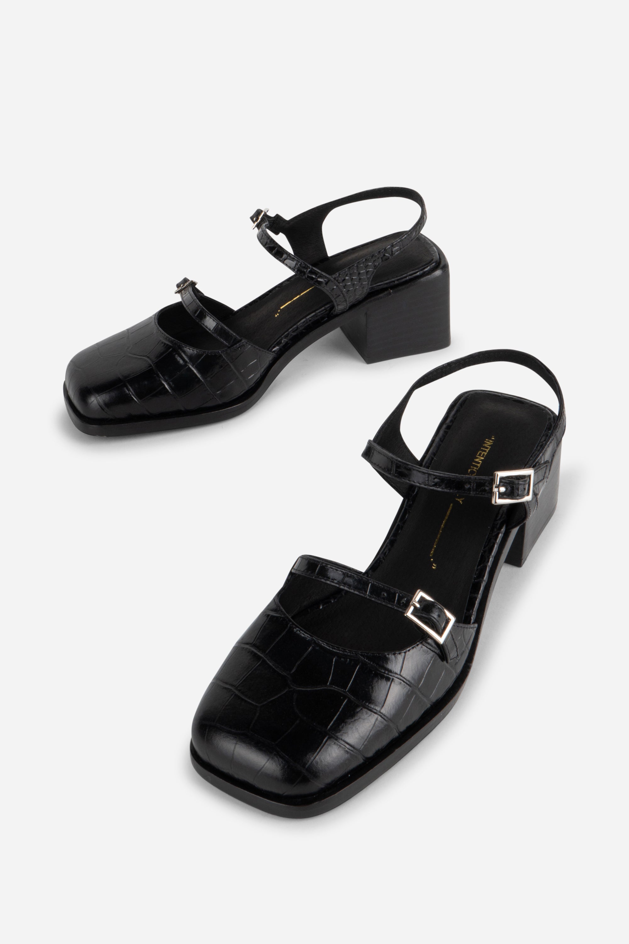 INTENTIONALLY __________. Mitzi Block Heel
