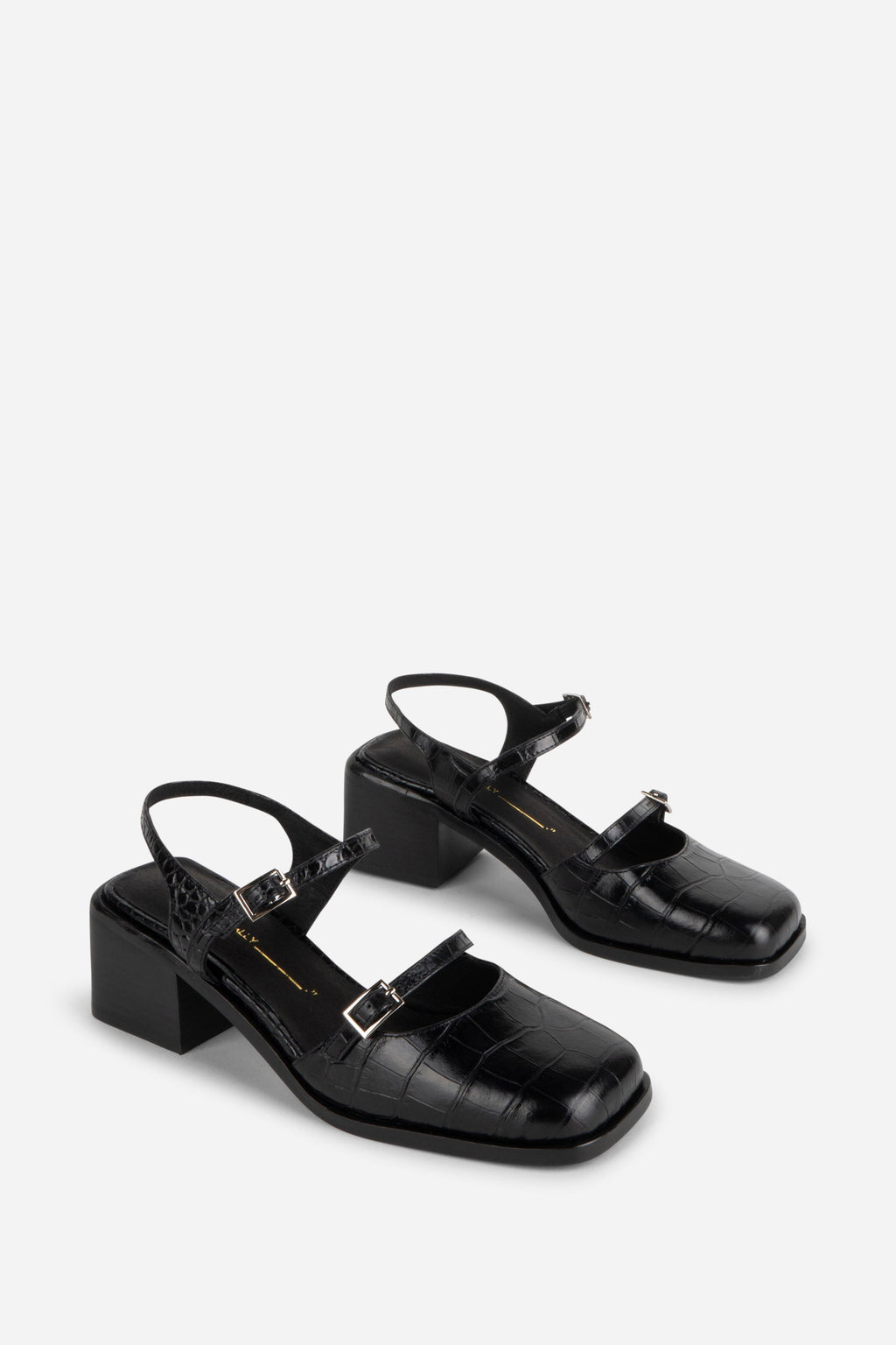 INTENTIONALLY __________. Mitzi Block Heel