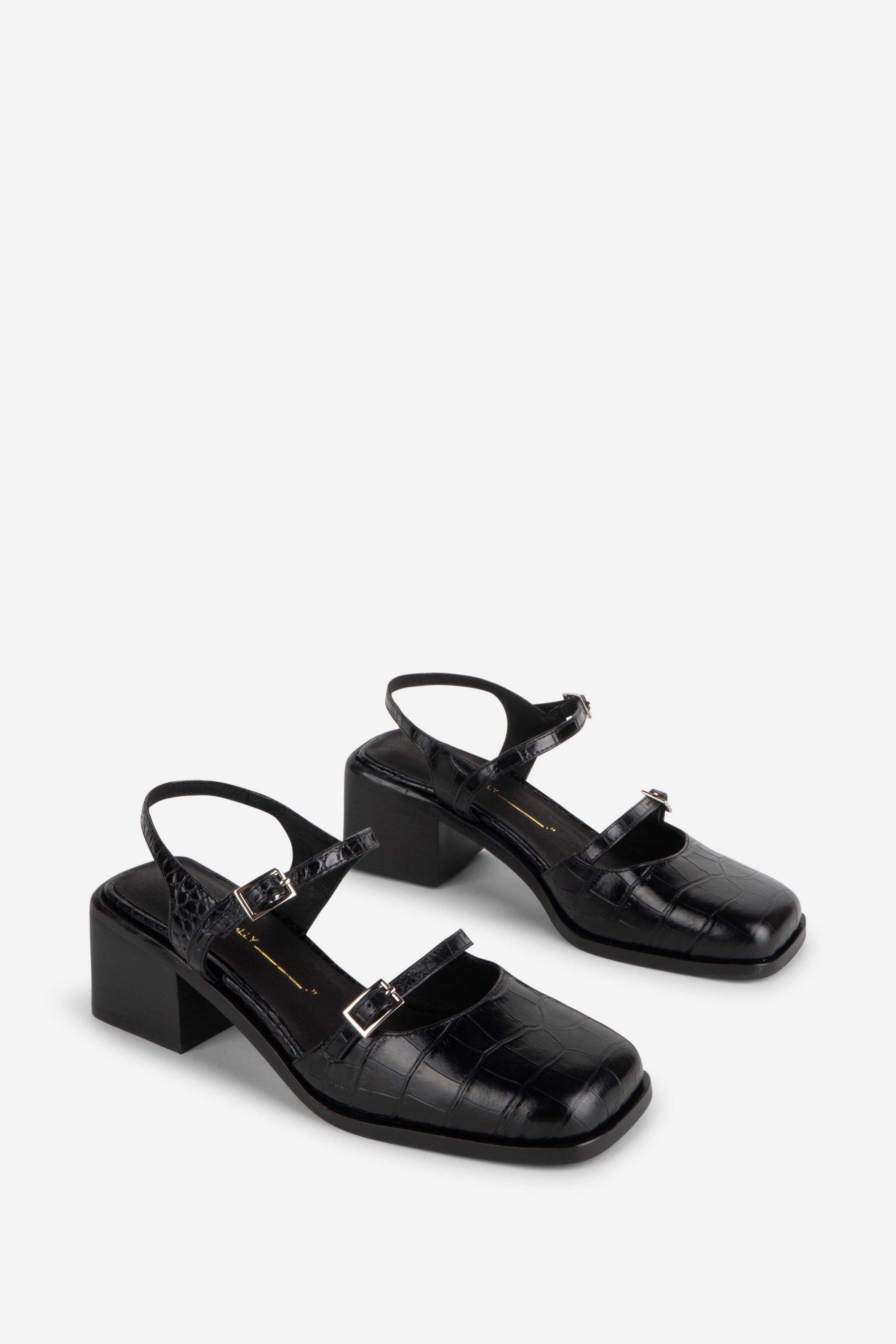 INTENTIONALLY __________. Mitzi Block Heel