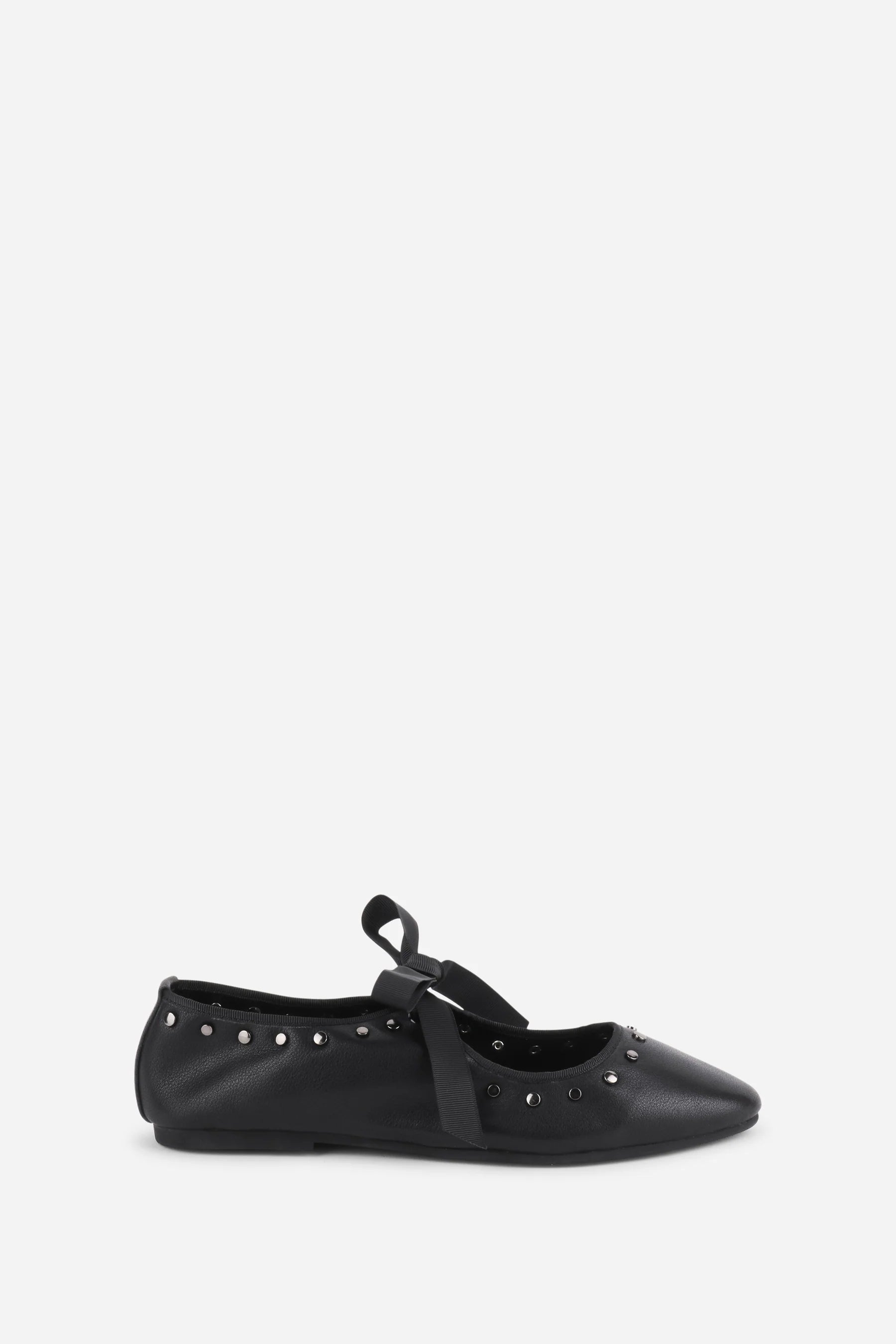 INTENTIONALLY __________. Peak Leather Ballet Flat
