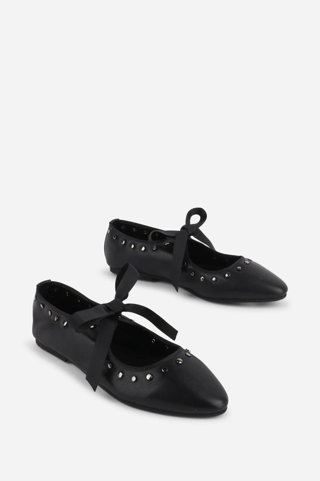 INTENTIONALLY __________. Peak Leather Ballet Flat