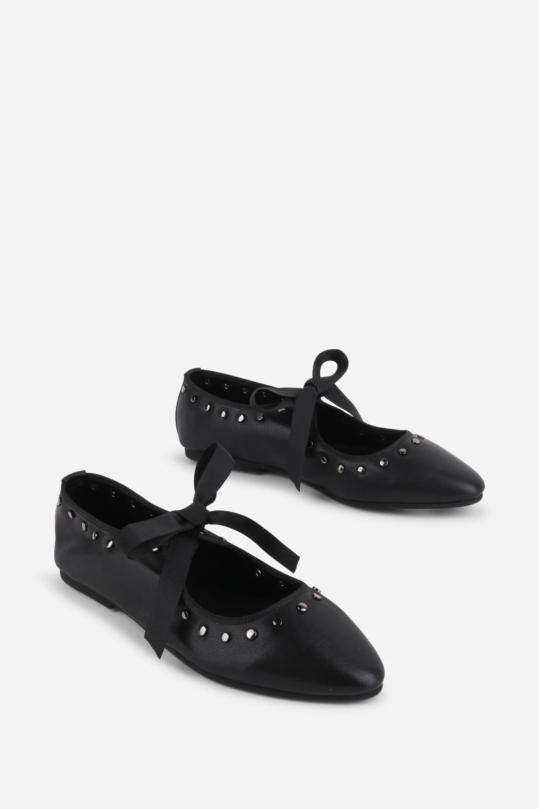 INTENTIONALLY __________. Peak Leather Ballet Flat