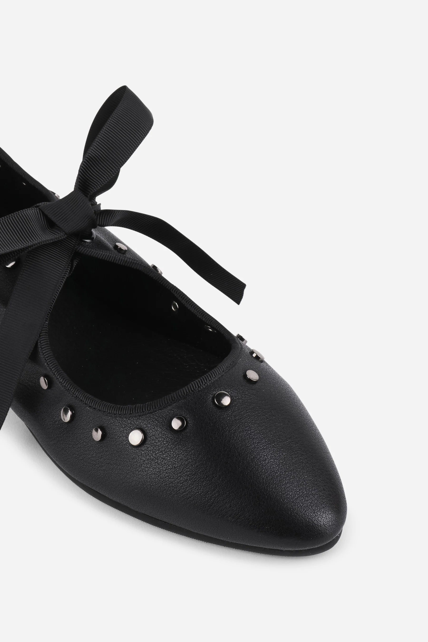 INTENTIONALLY __________. Peak Leather Ballet Flat