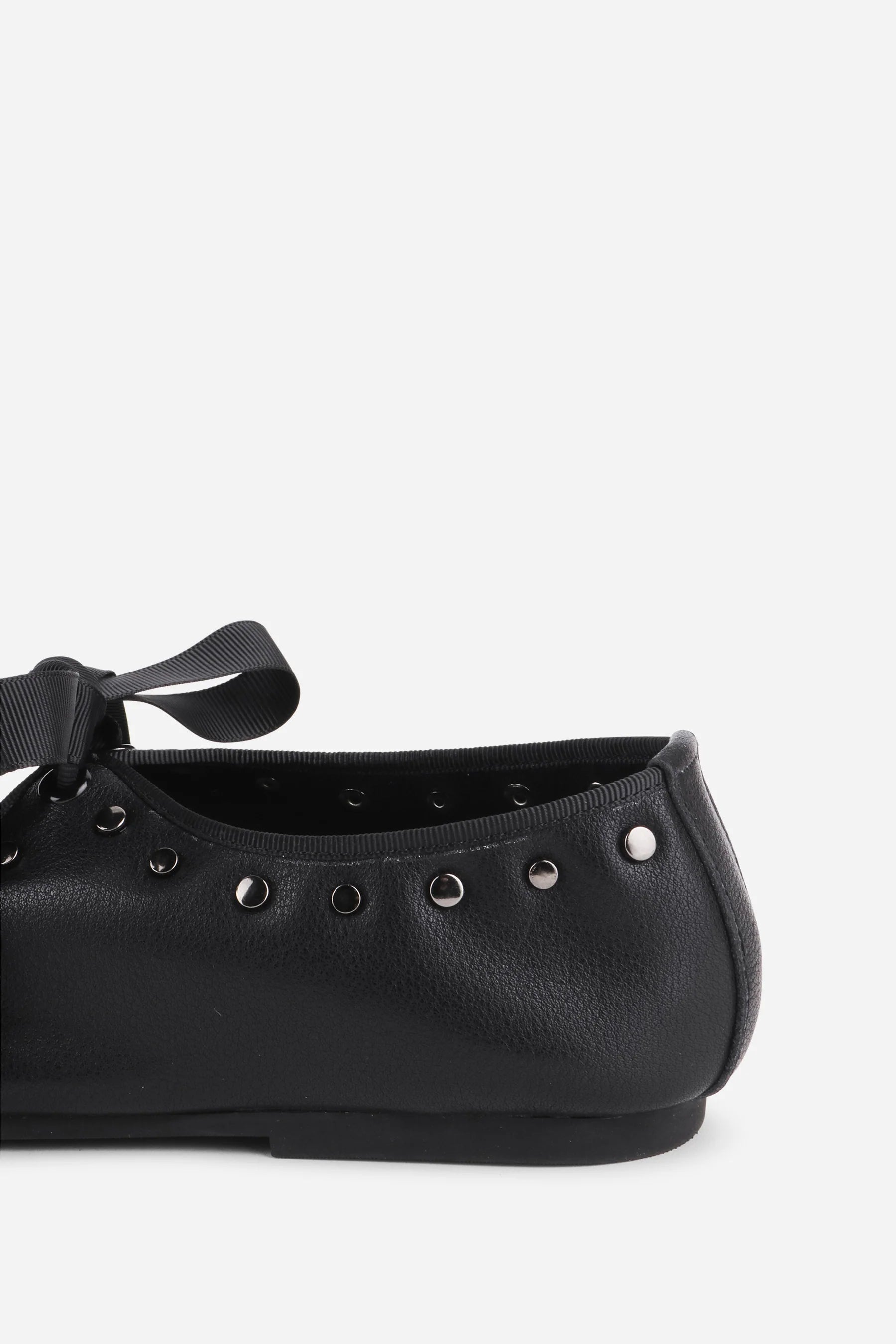 INTENTIONALLY __________. Peak Leather Ballet Flat