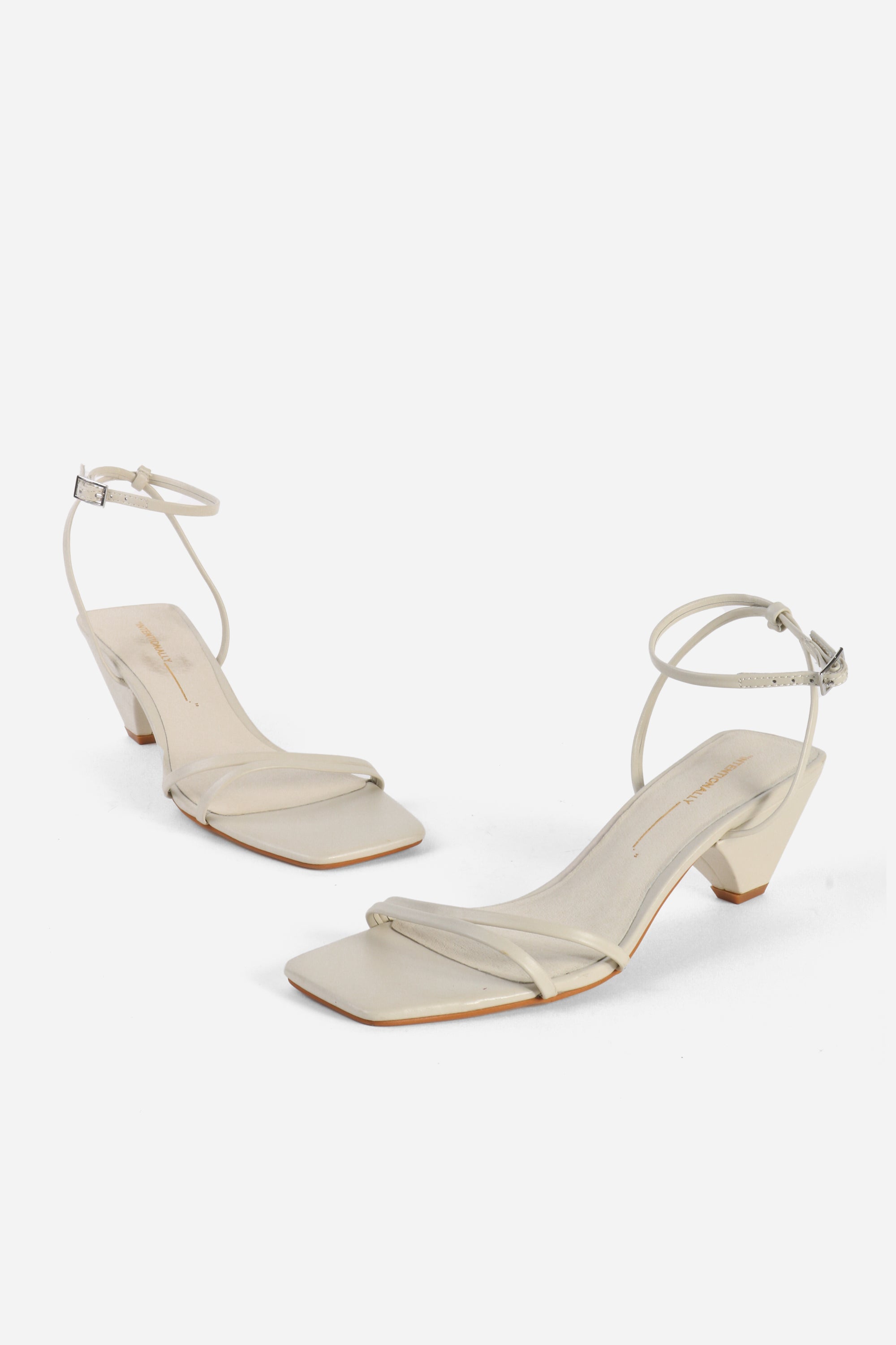 INTENTIONALLY __________. Pretty Please Leather Heel