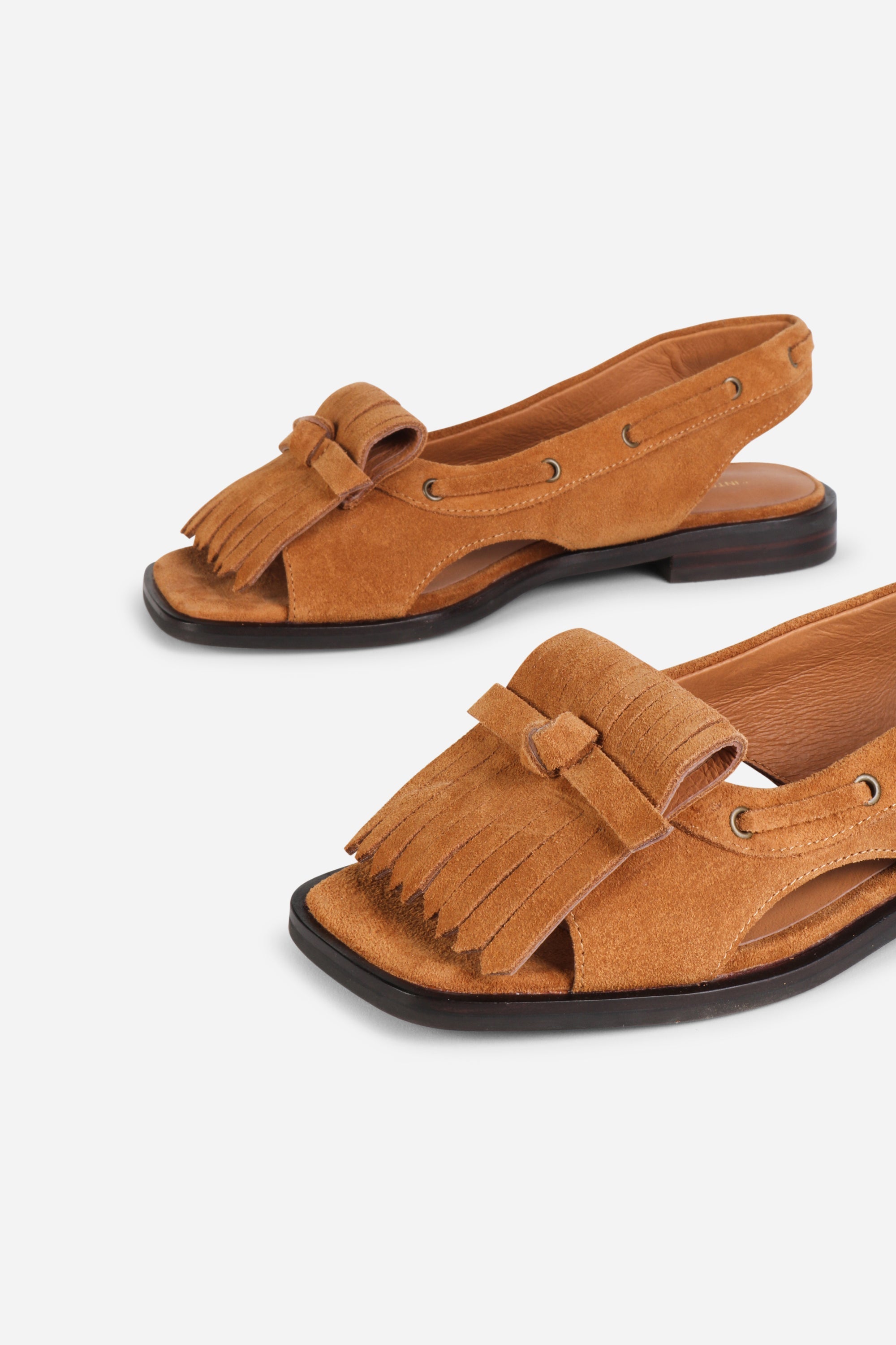 INTENTIONALLY __________. Professor Flat Fringe Sandal - Tawny