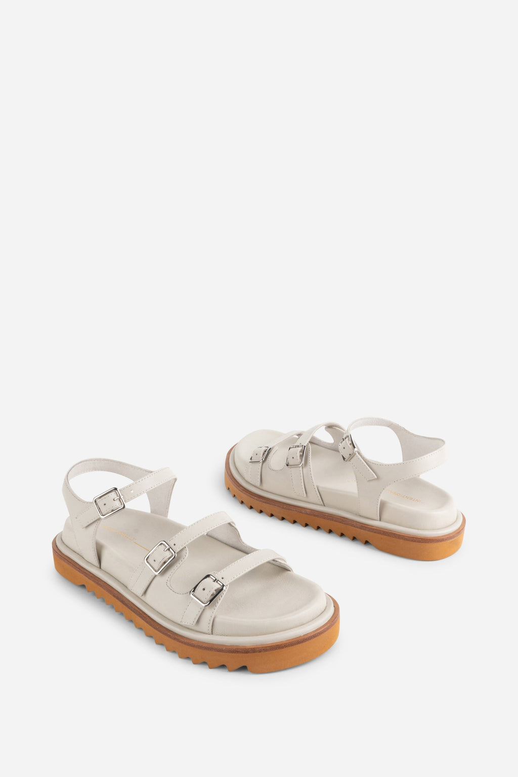 INTENTIONALLY __________. Ricoya Leather Sandal