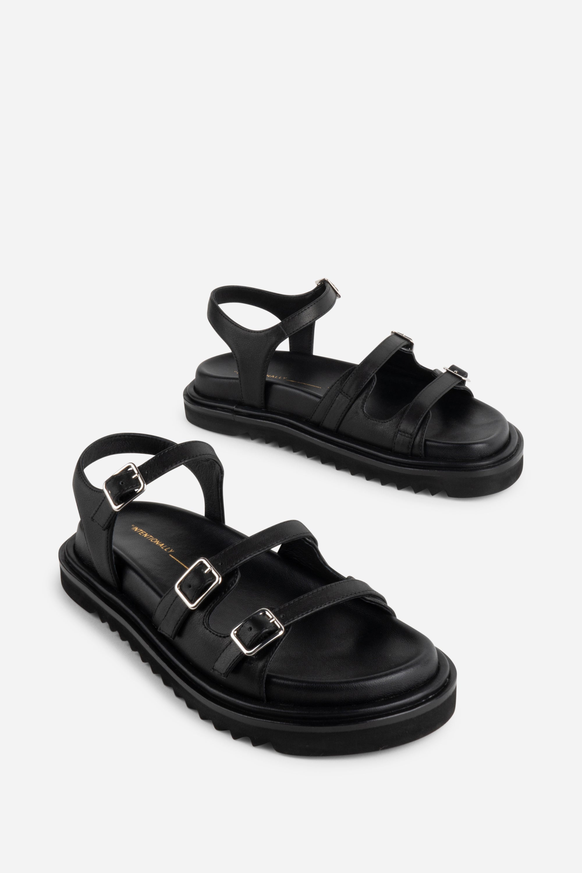 INTENTIONALLY __________. Ricoya Leather Sandal