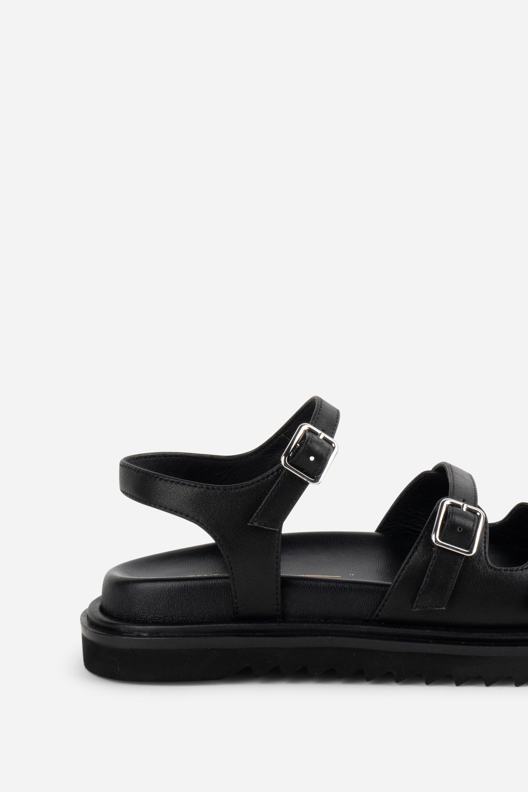 INTENTIONALLY __________. Ricoya Leather Sandal