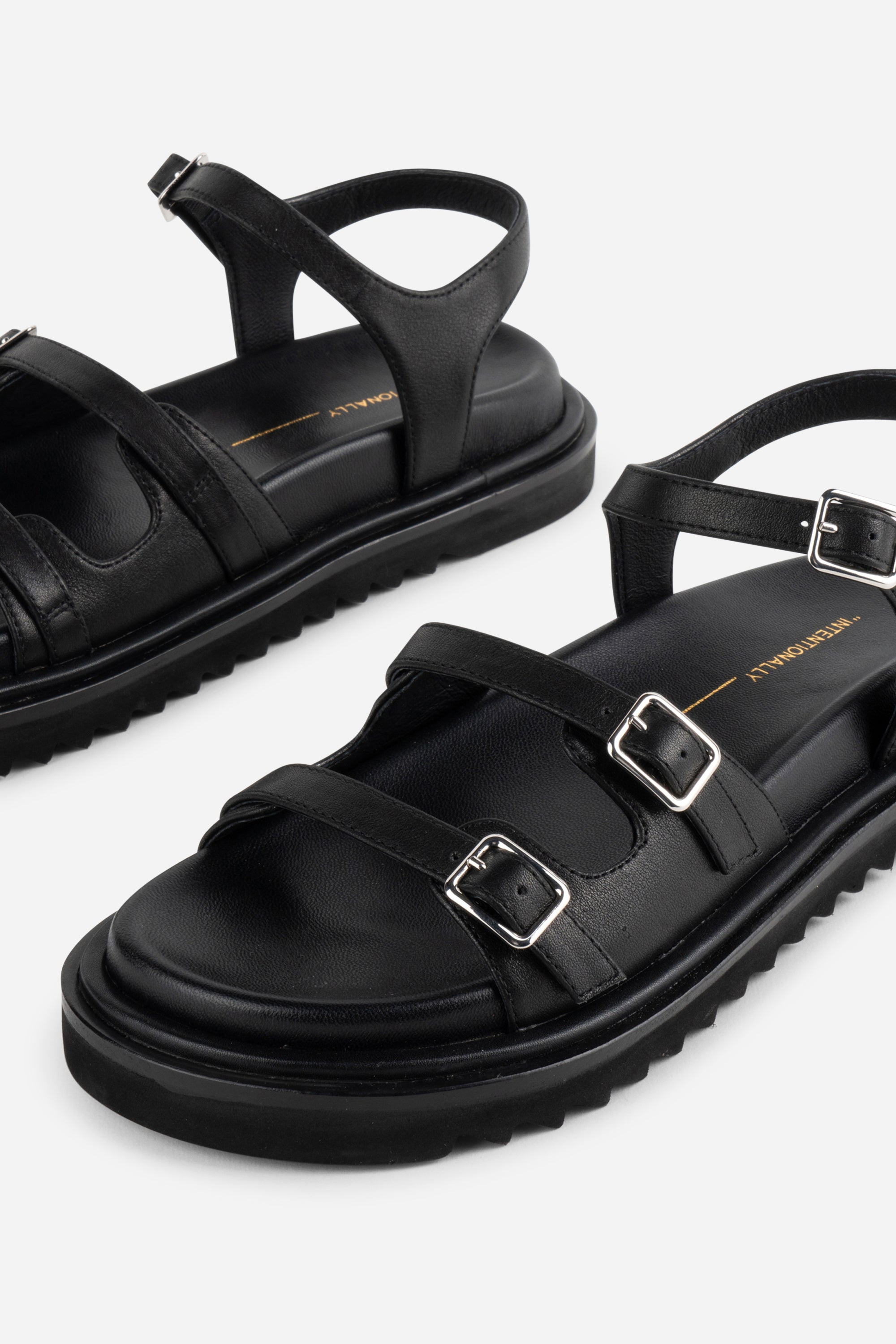 INTENTIONALLY __________. Ricoya Leather Sandal