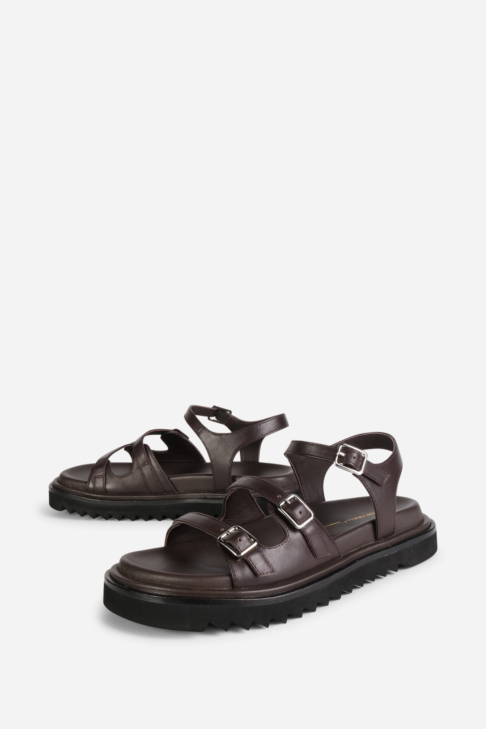 INTENTIONALLY __________. Ricoya Leather Sandal