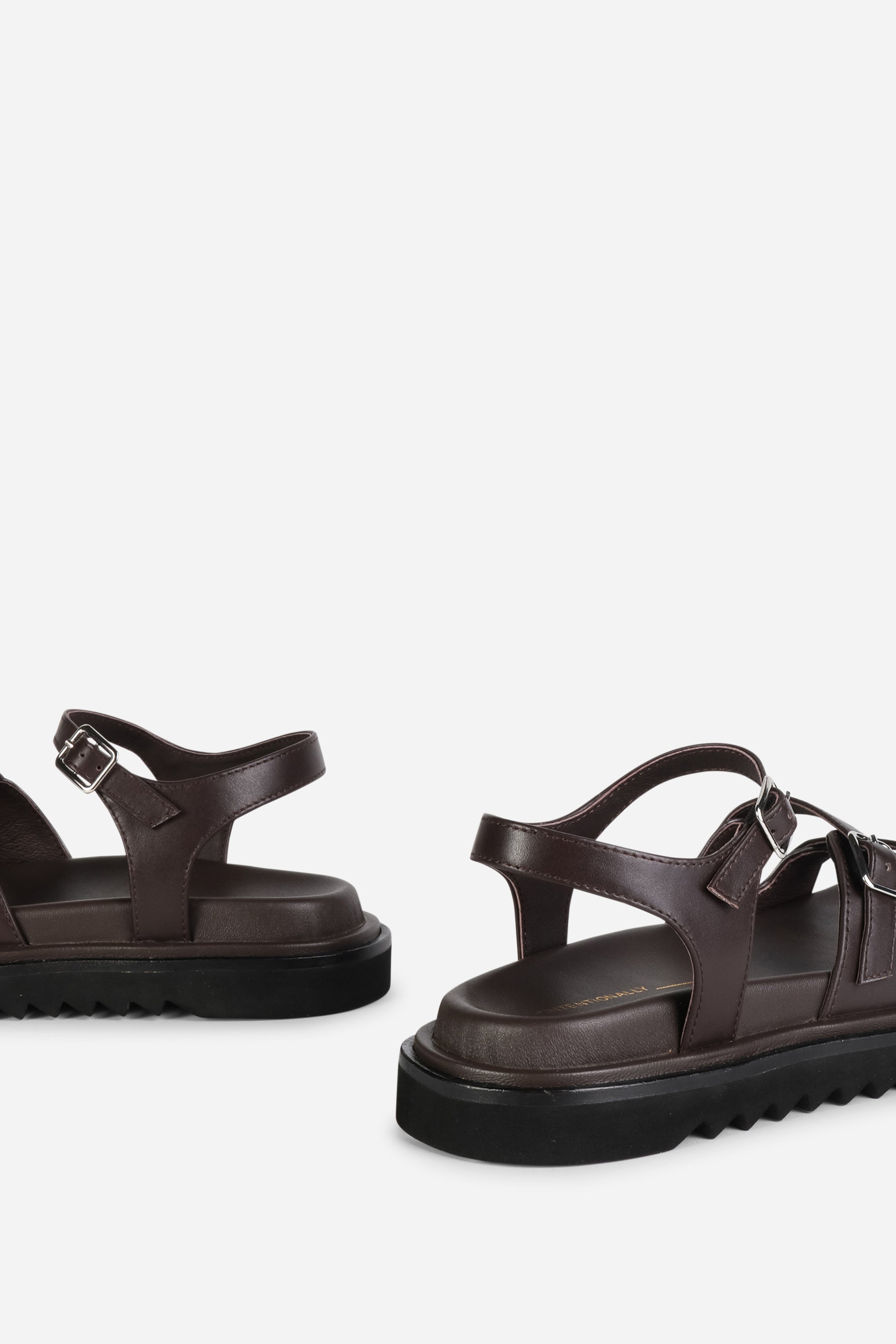 INTENTIONALLY __________. Ricoya Leather Sandal