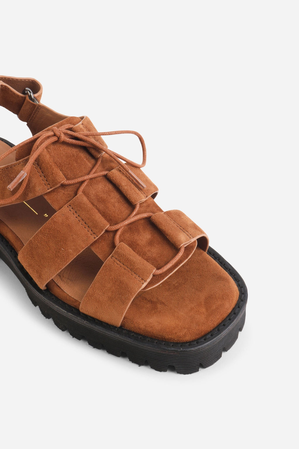 INTENTIONALLY __________. Hampton Sandals