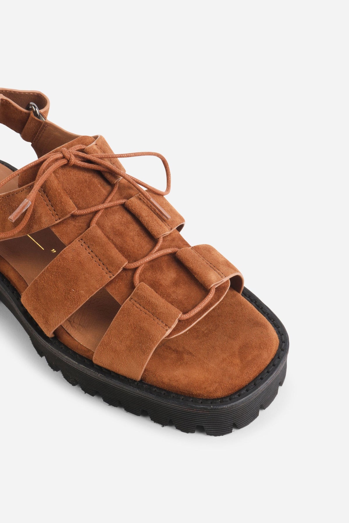 INTENTIONALLY __________. Hampton Sandals