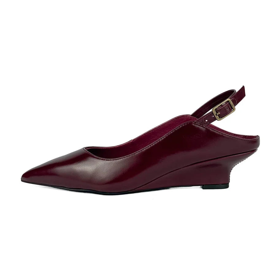 "INTENTIONALLY __________." Lift Slingback Heel
