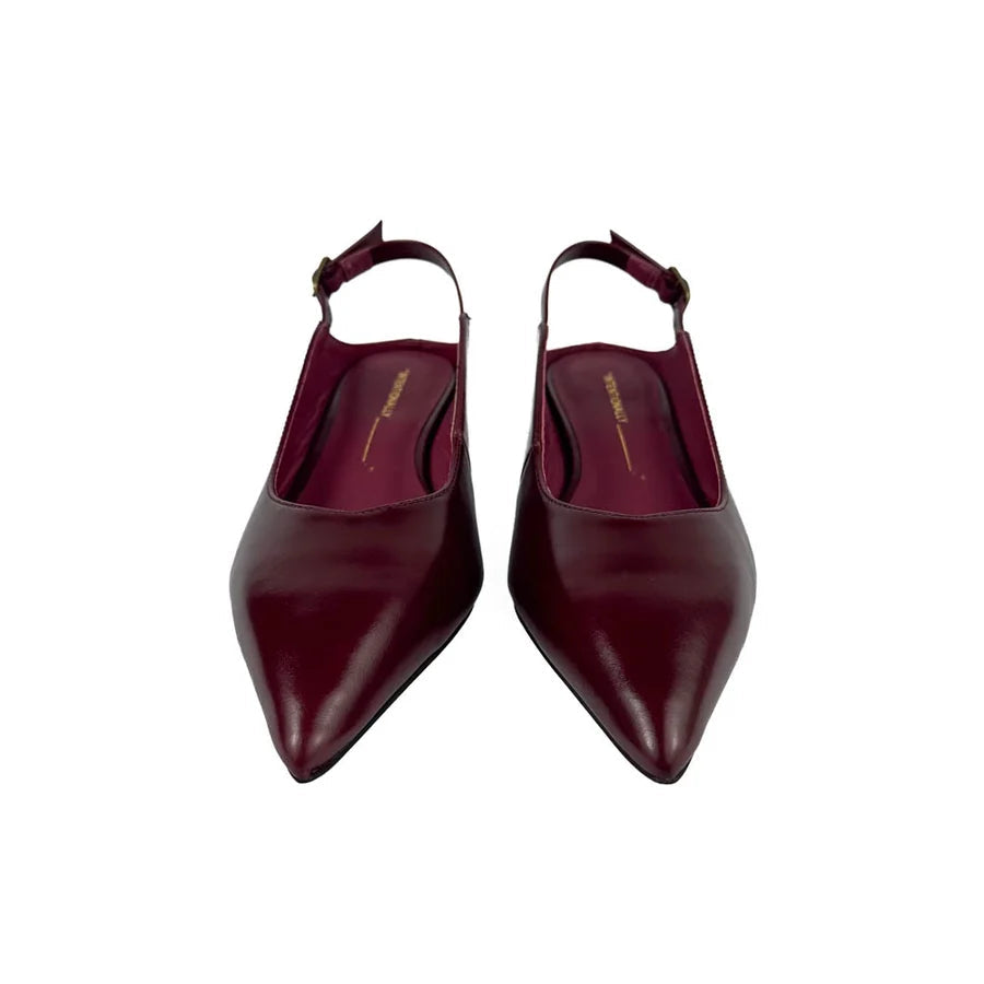 "INTENTIONALLY __________." Lift Slingback Heel