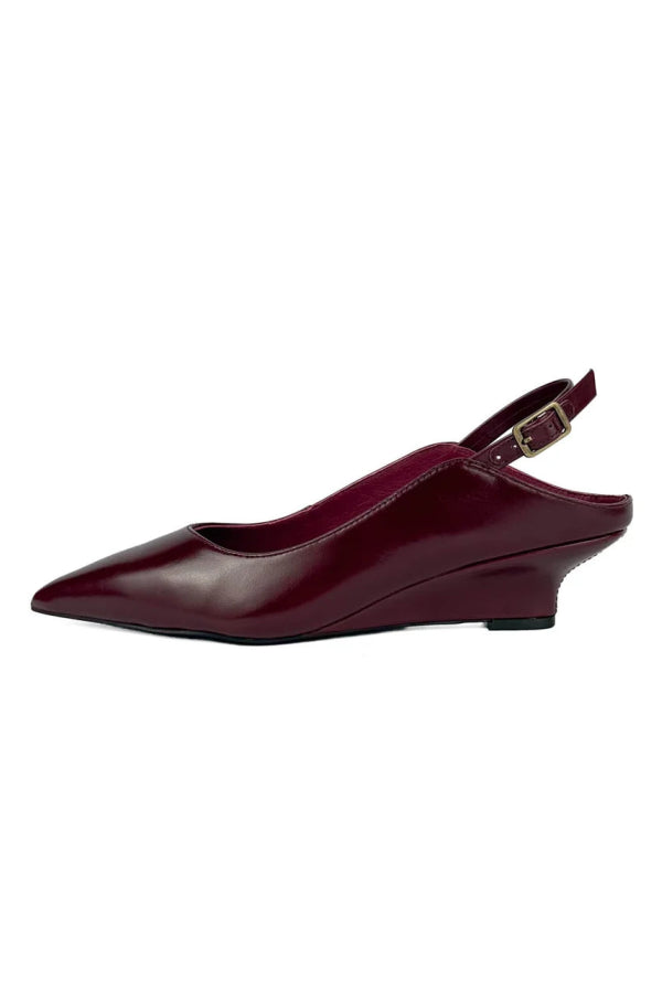 "INTENTIONALLY __________." Lift Slingback Heel