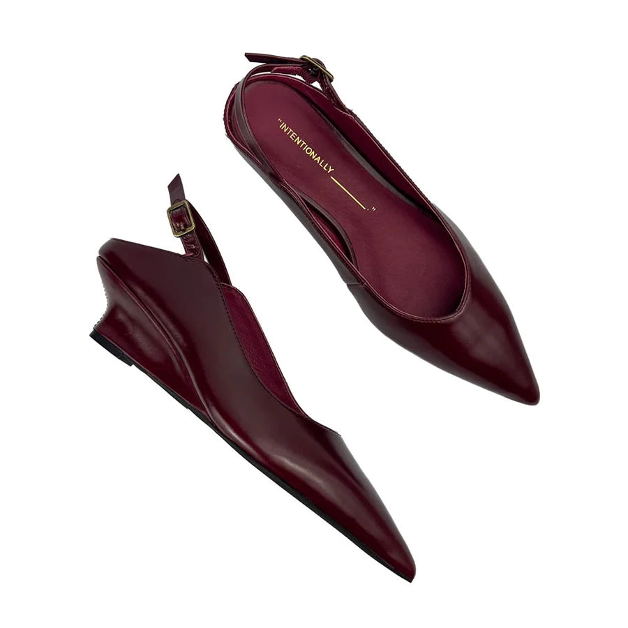 "INTENTIONALLY __________." Lift Slingback Heel