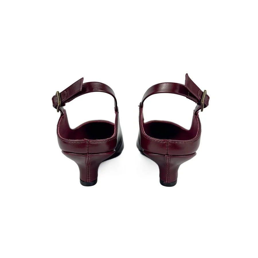 "INTENTIONALLY __________." Lift Slingback Heel