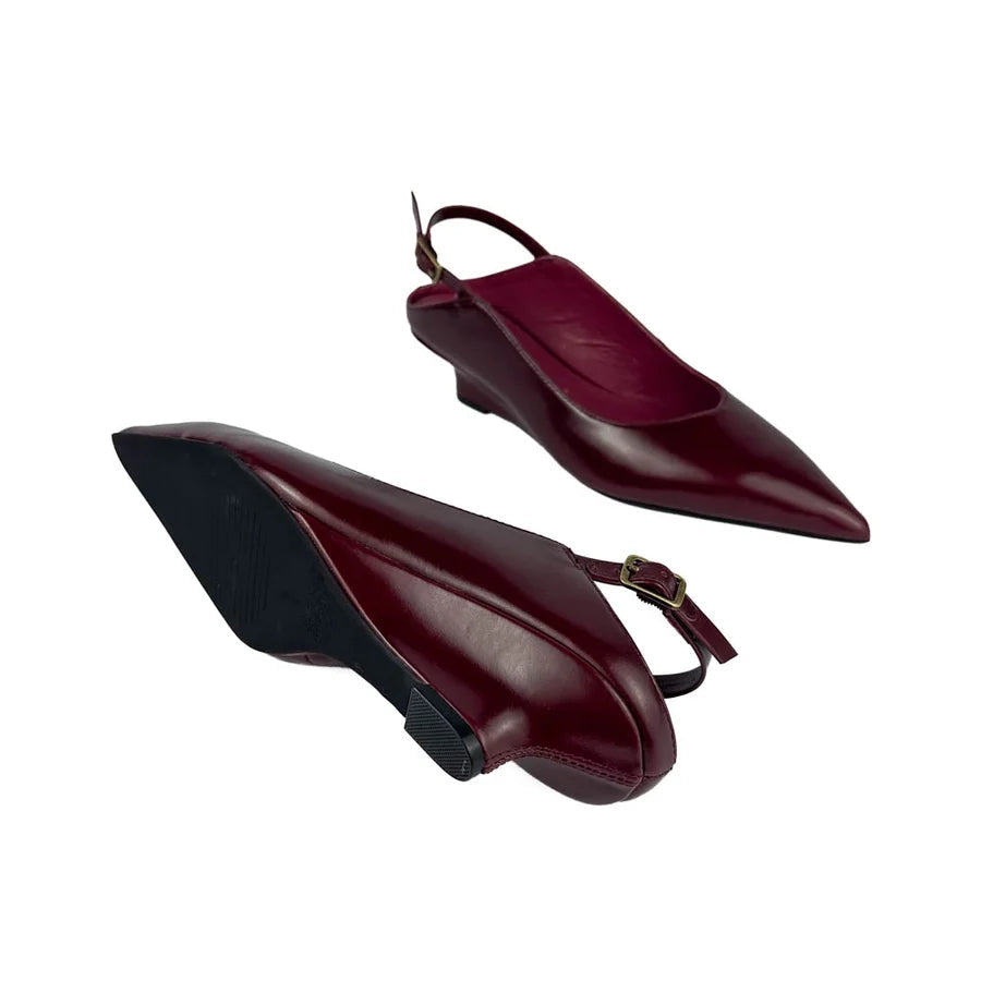 "INTENTIONALLY __________." Lift Slingback Heel