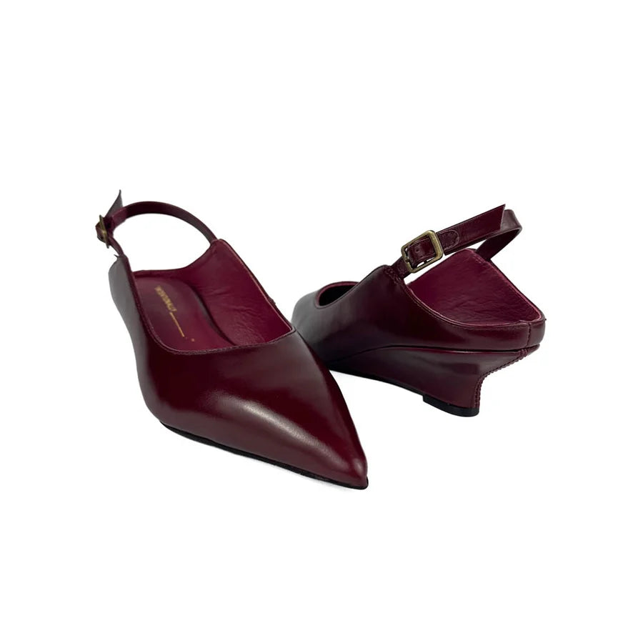 "INTENTIONALLY __________." Lift Slingback Heel