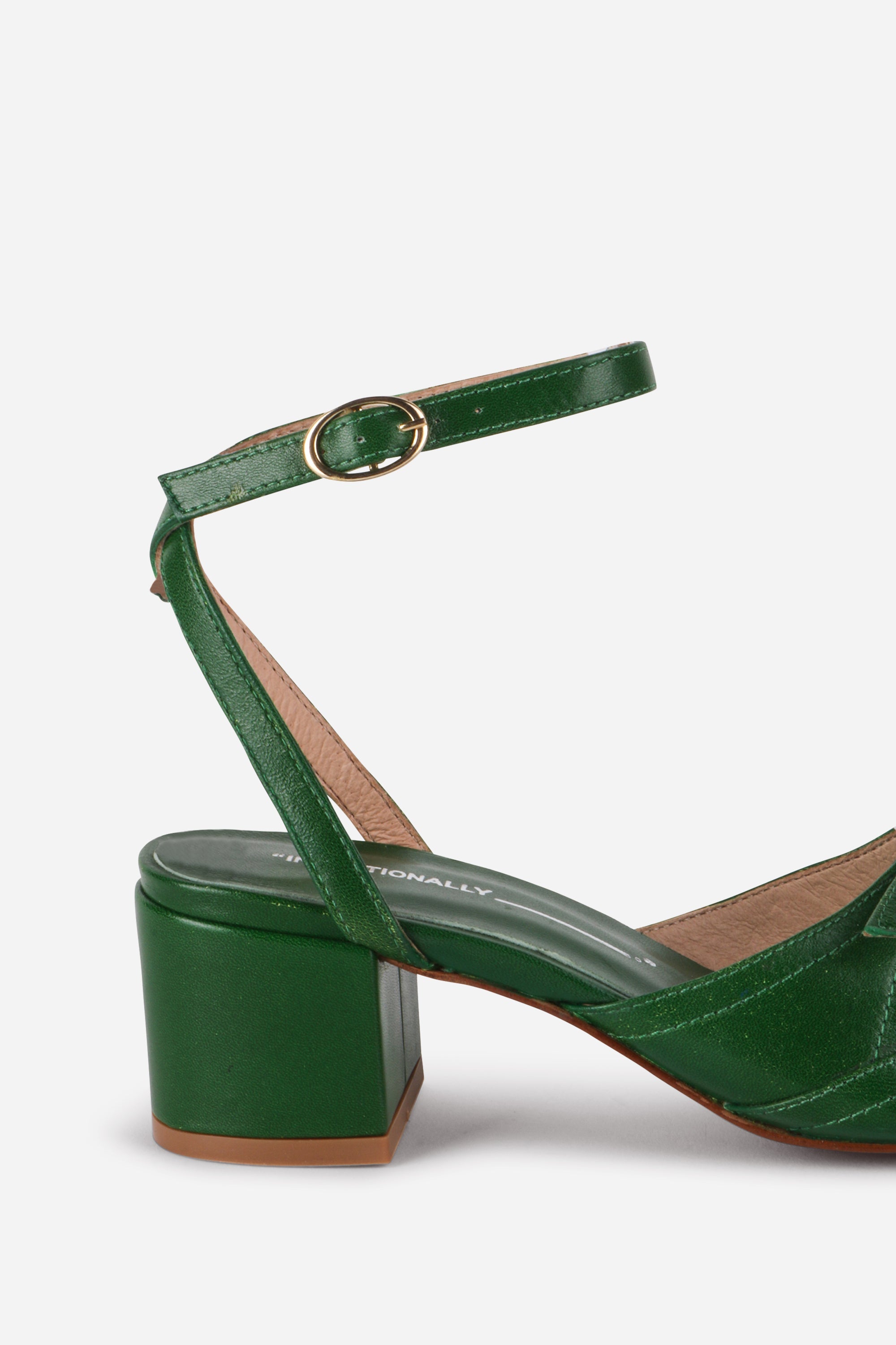 INTENTIONALLY __________. Lingo Heeled Sandals