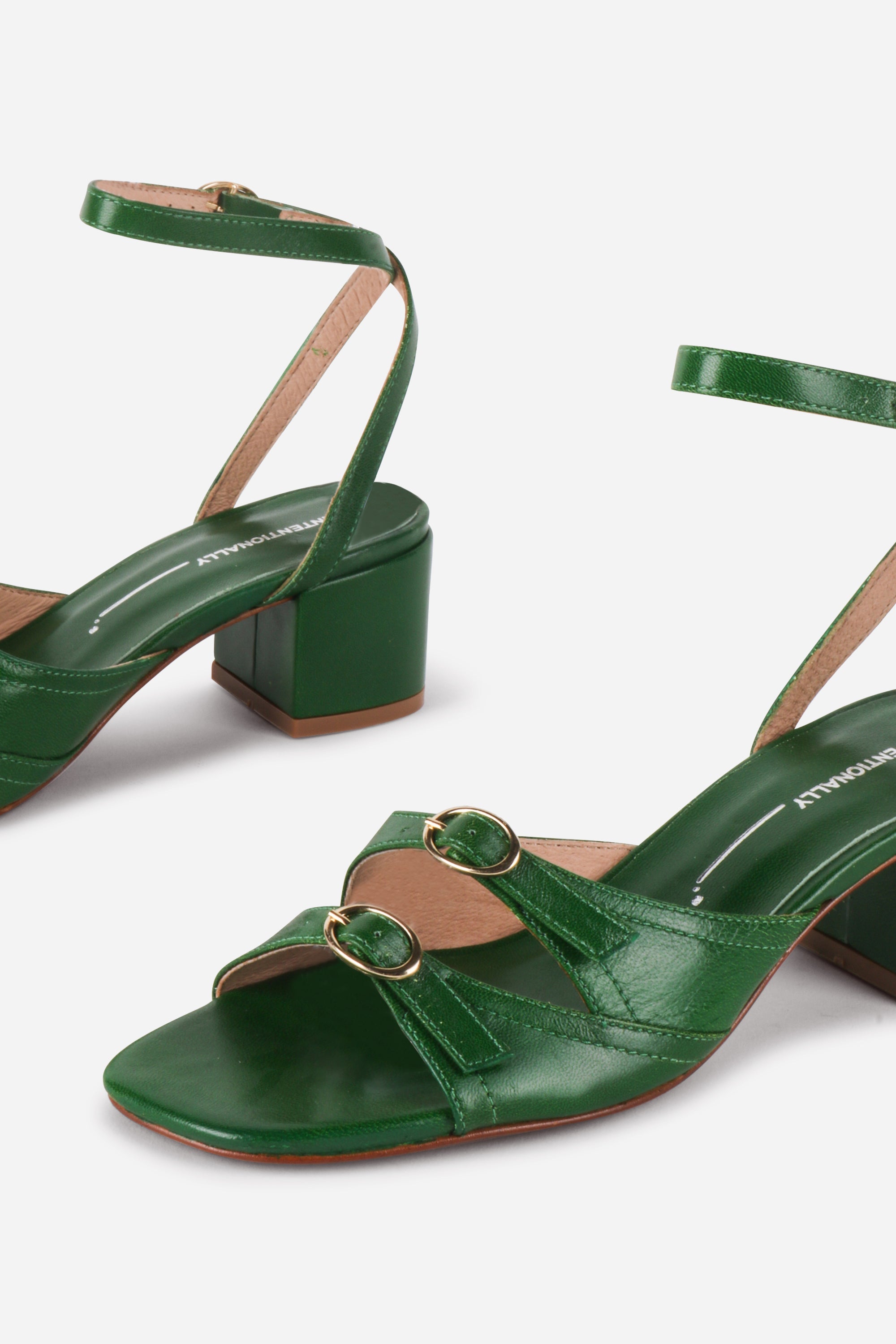 INTENTIONALLY __________. Lingo Heeled Sandals