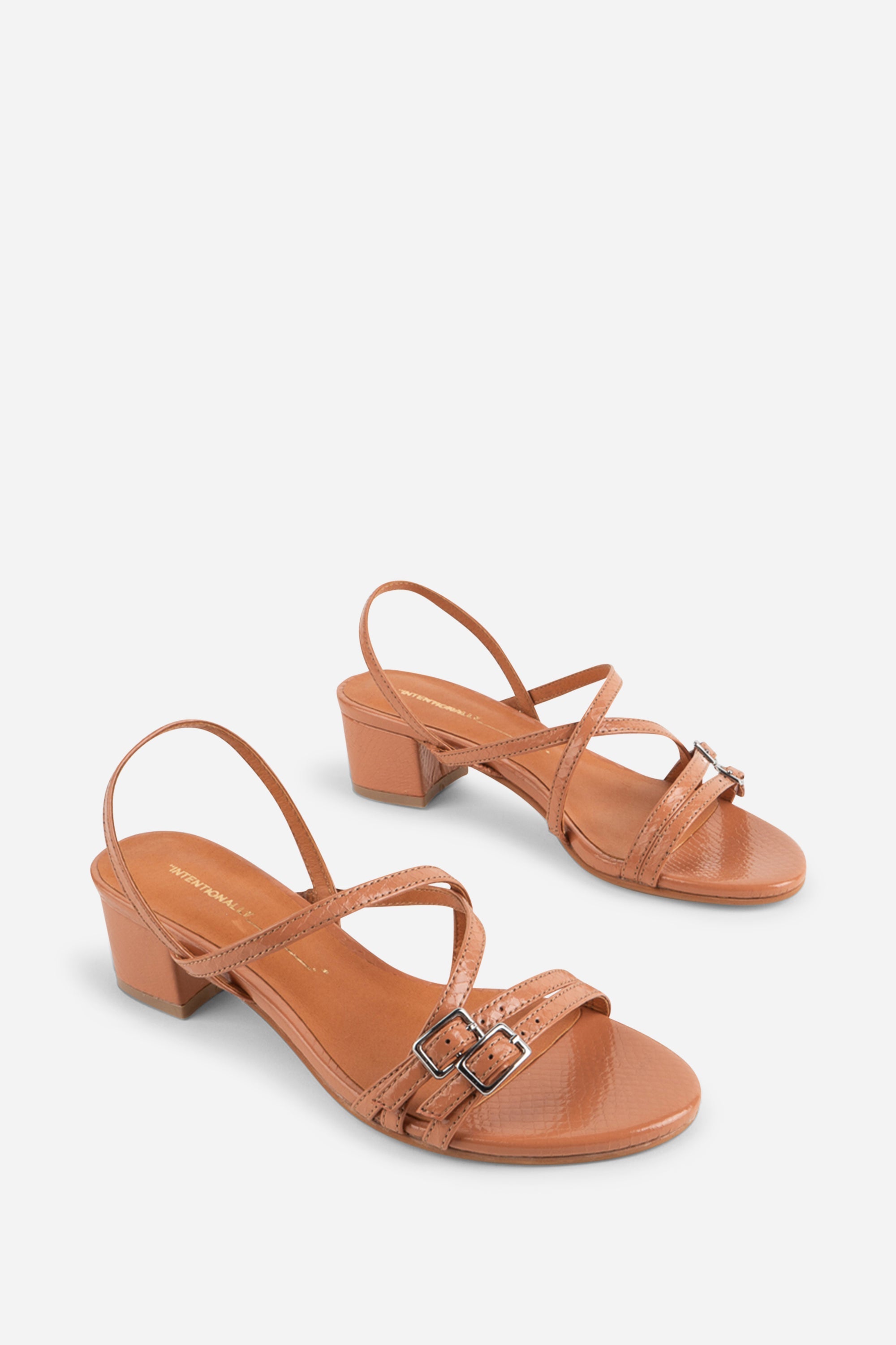 INTENTIONALLY __________. Kariton Block Heel Sandal
