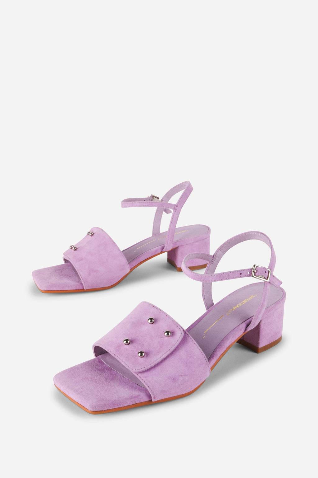 INTENTIONALLY __________. Karizma Block Heel Sandal