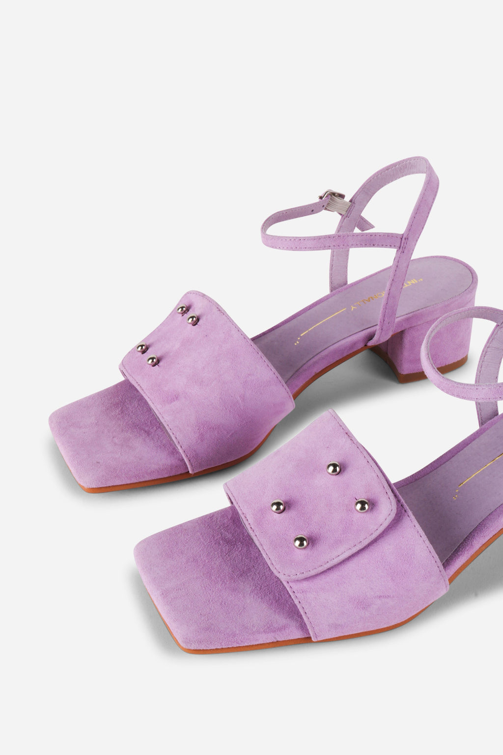 INTENTIONALLY __________. Karizma Block Heel Sandal
