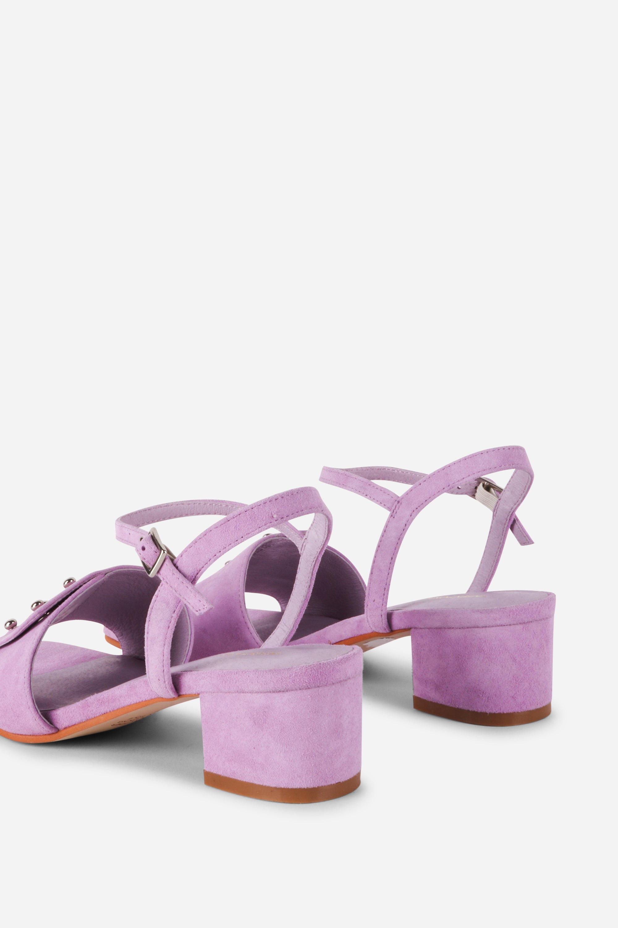 INTENTIONALLY __________. Karizma Block Heel Sandal