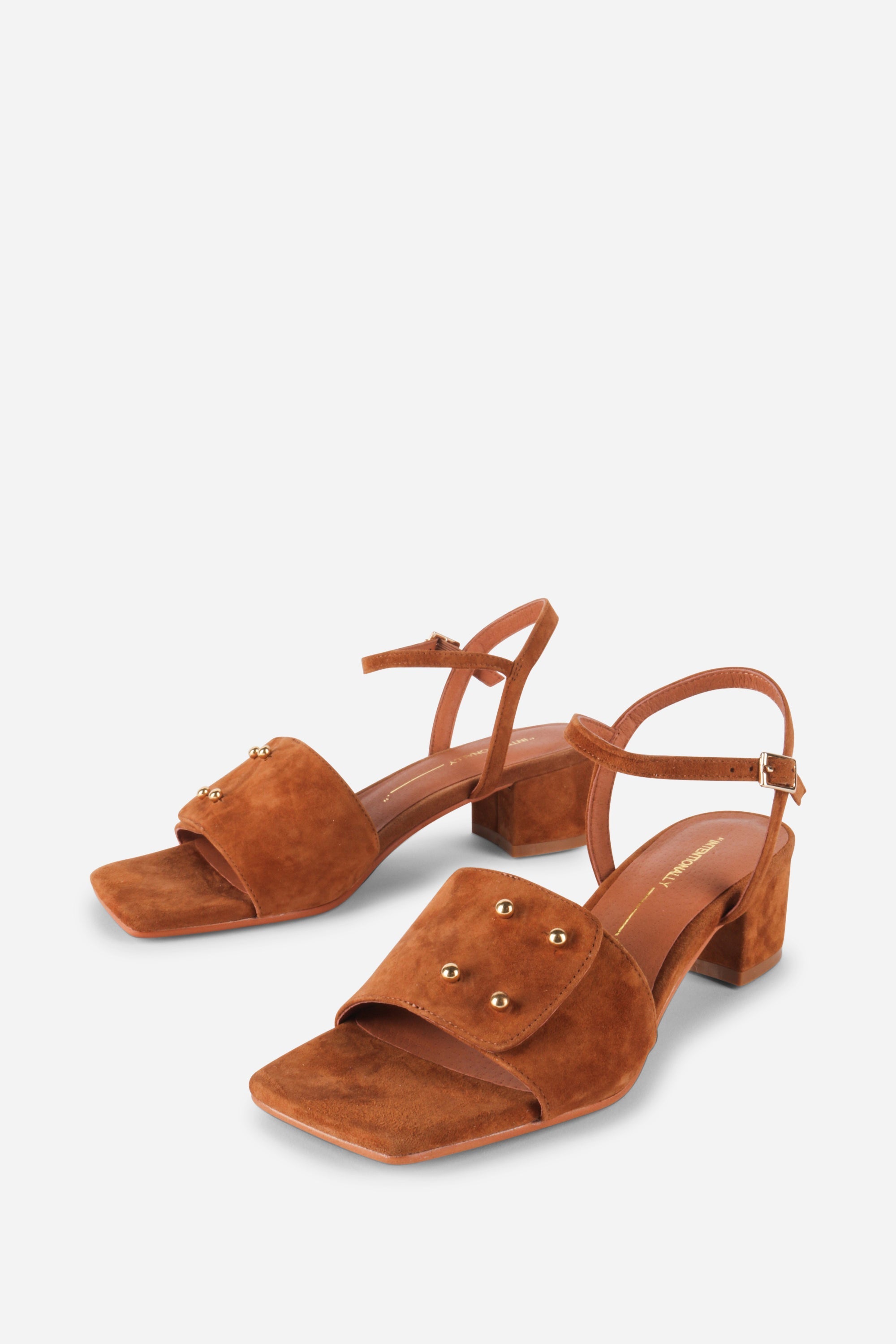 INTENTIONALLY __________. Karizma Block Heel Sandal
