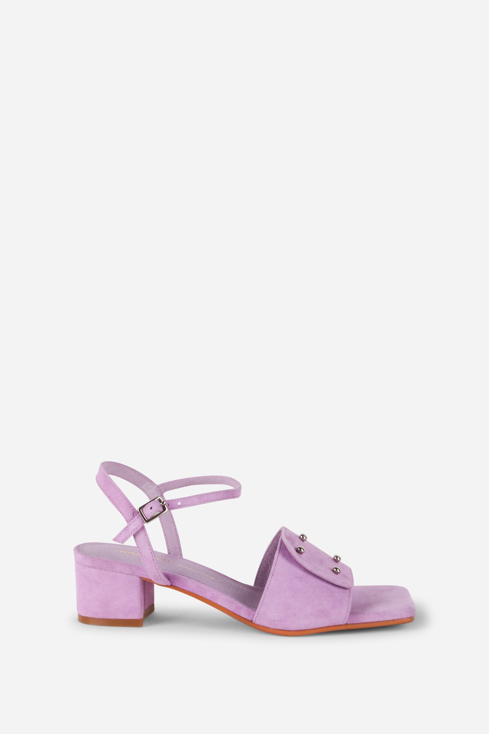 INTENTIONALLY __________. Karizma Block Heel Sandal