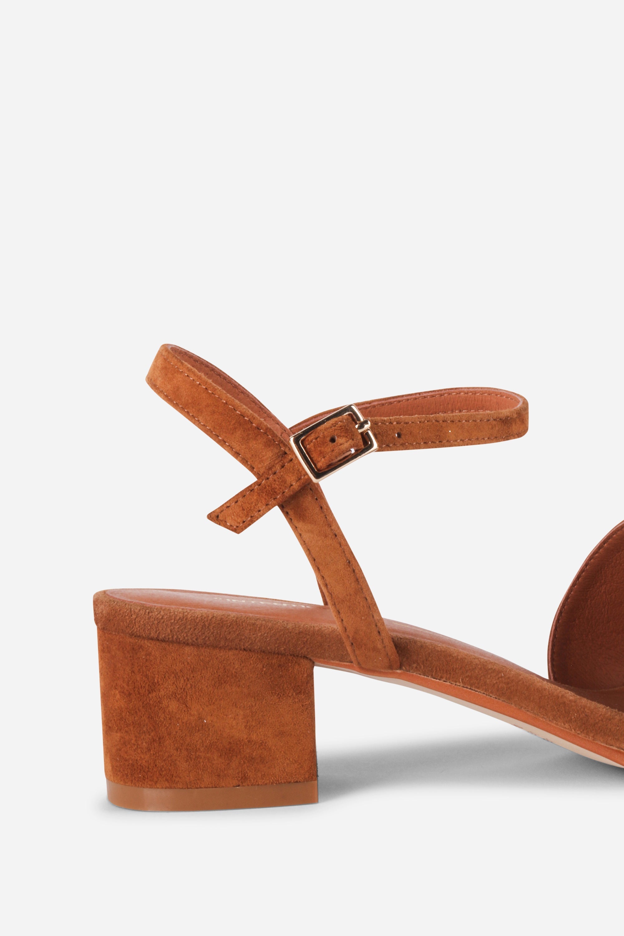 INTENTIONALLY __________. Karizma Block Heel Sandal