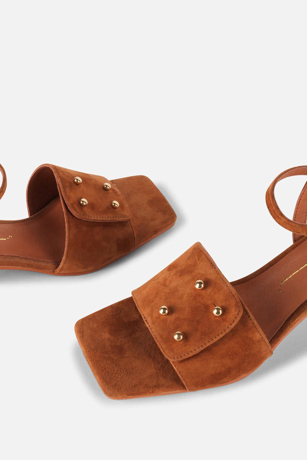 INTENTIONALLY __________. Karizma Block Heel Sandal