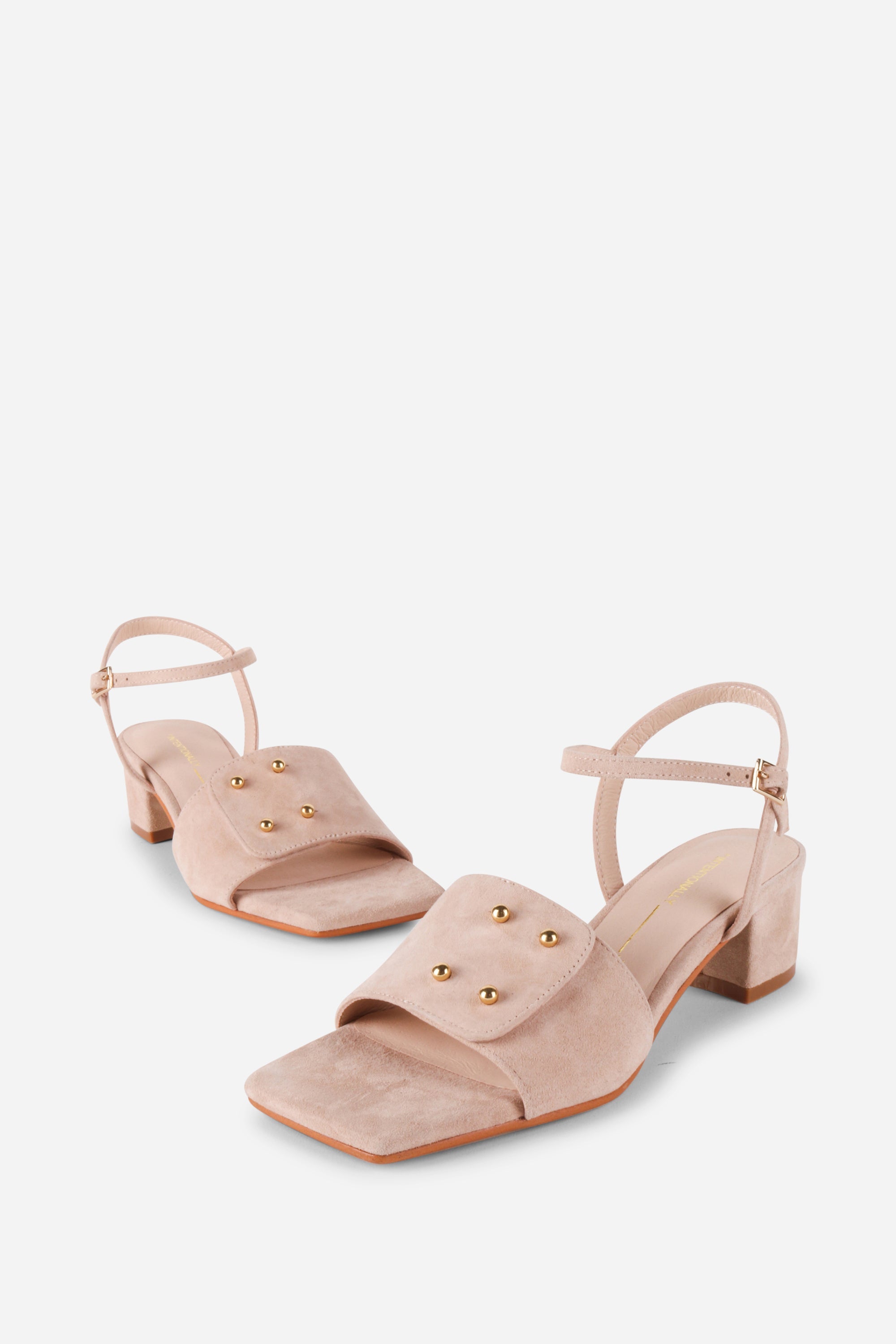 INTENTIONALLY __________. Karizma Block Heel Sandal