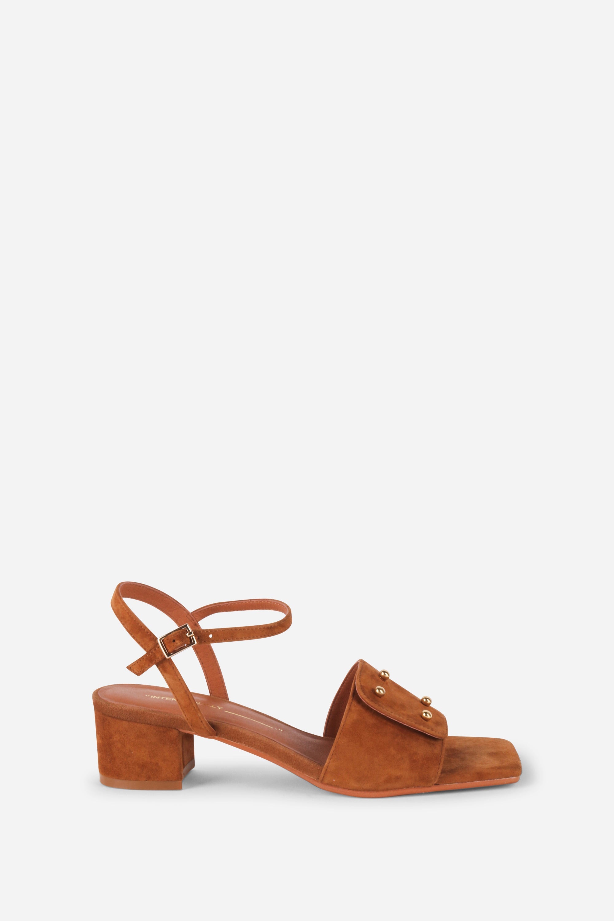 INTENTIONALLY __________. Karizma Block Heel Sandal