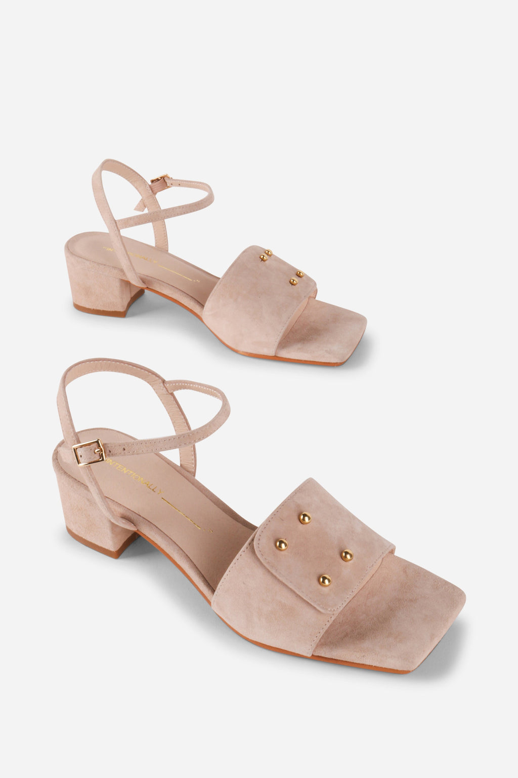 INTENTIONALLY __________. Karizma Block Heel Sandal