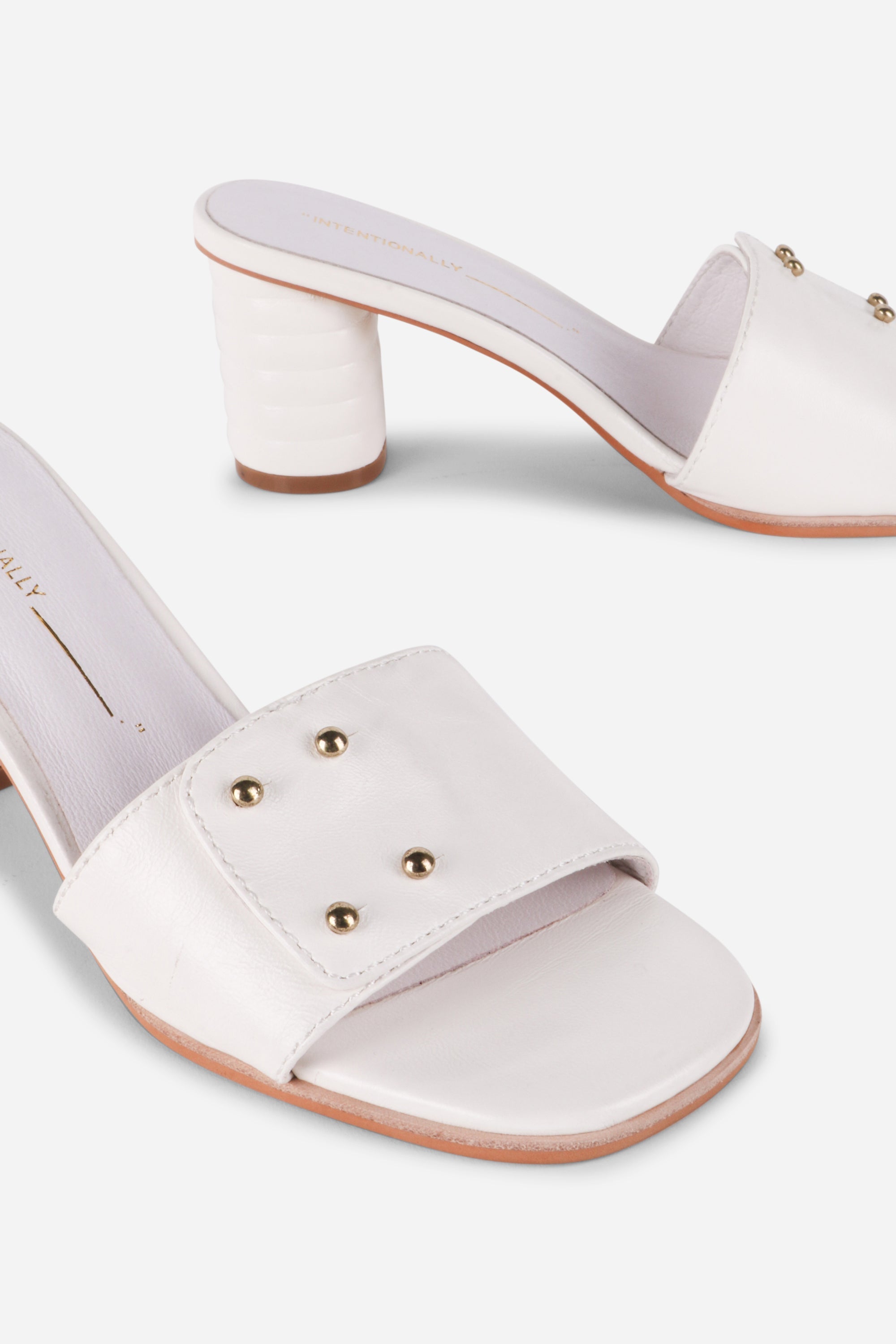 INTENTIONALLY __________. Kizmit Mule Heels