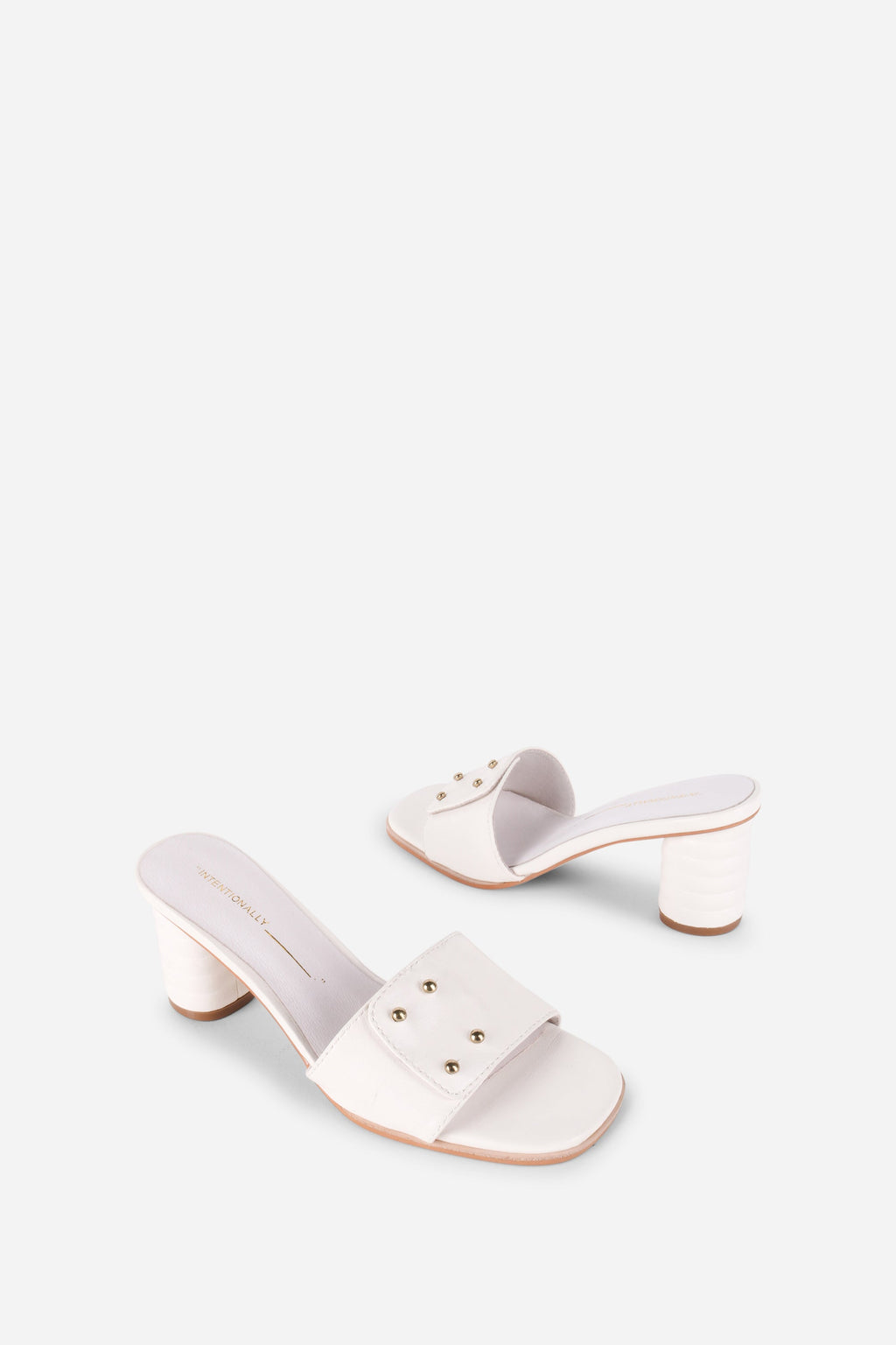 INTENTIONALLY __________. Kizmit Mule Heels