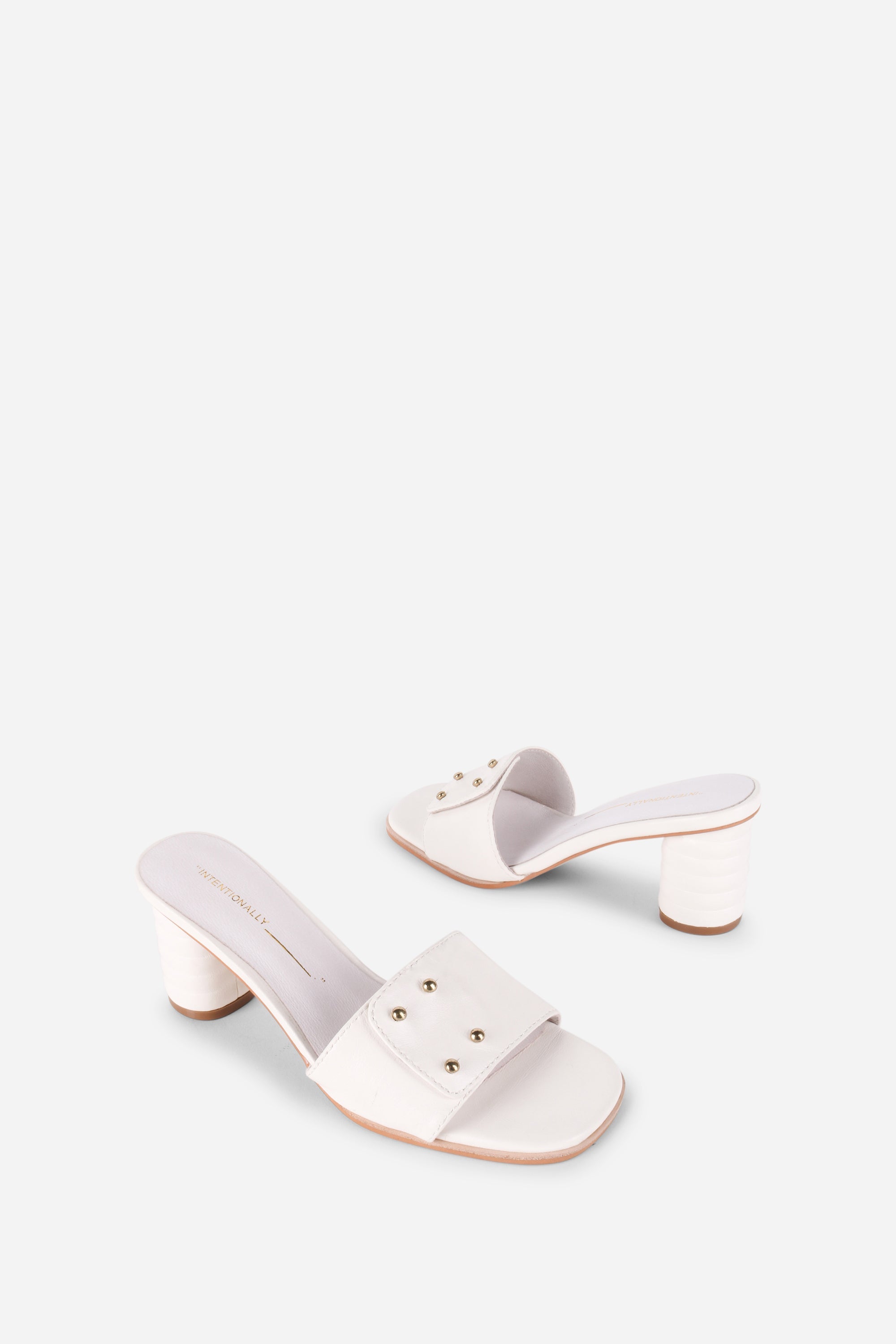 INTENTIONALLY __________. Kizmit Mule Heels