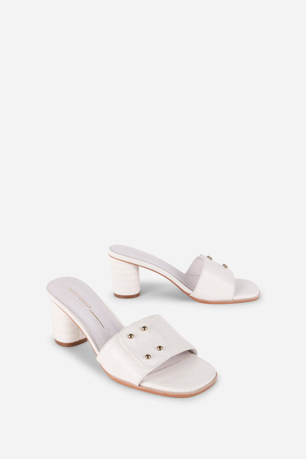 INTENTIONALLY __________. Kizmit Mule Heels