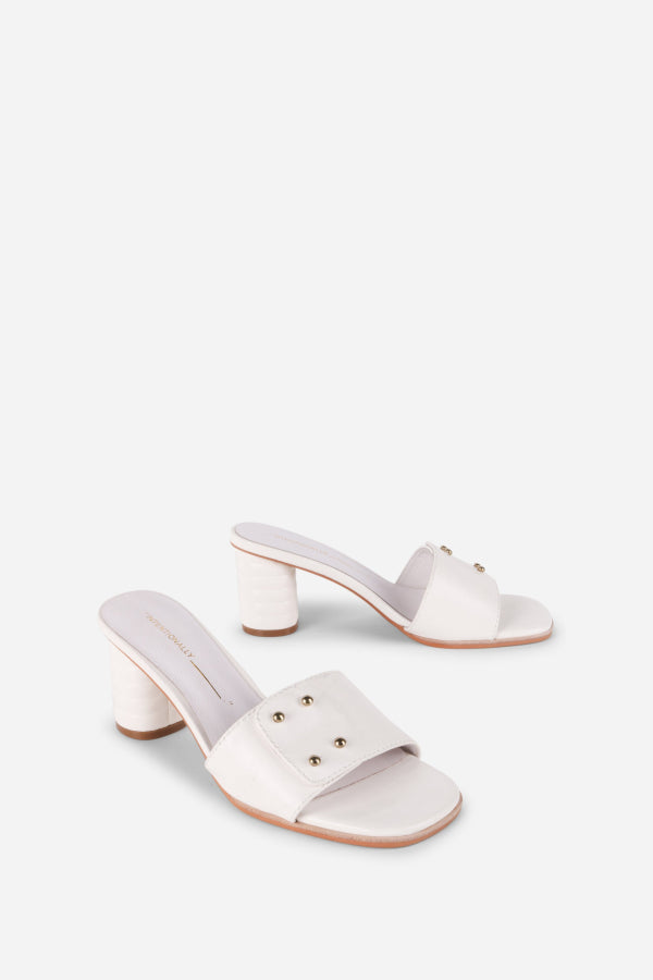 INTENTIONALLY __________. Kizmit Mule Heels