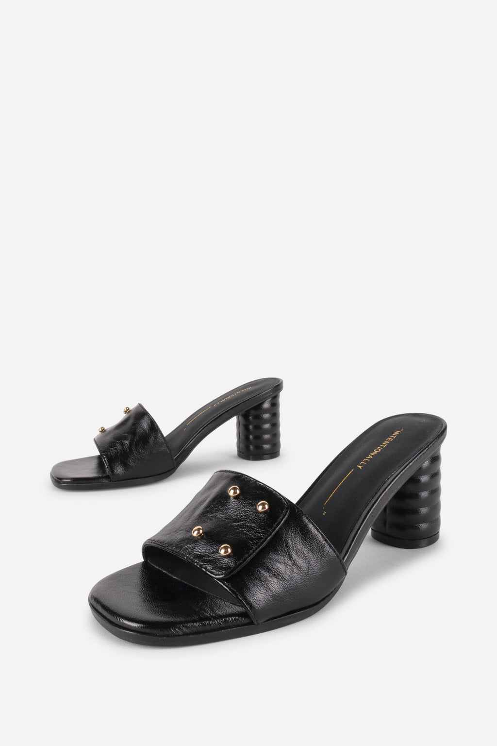 INTENTIONALLY __________. Kizmit Mule Heels