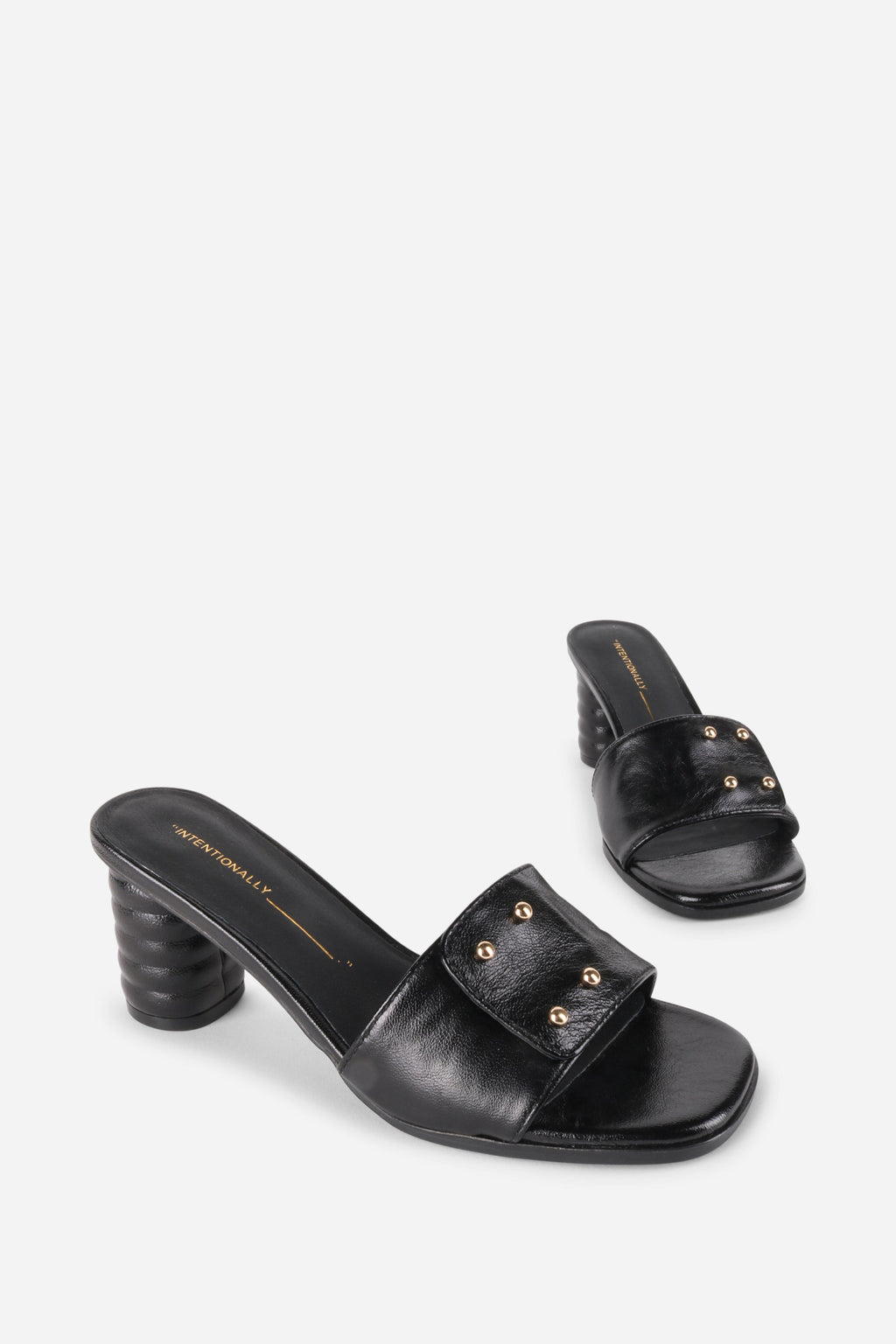 INTENTIONALLY __________. Kizmit Mule Heels