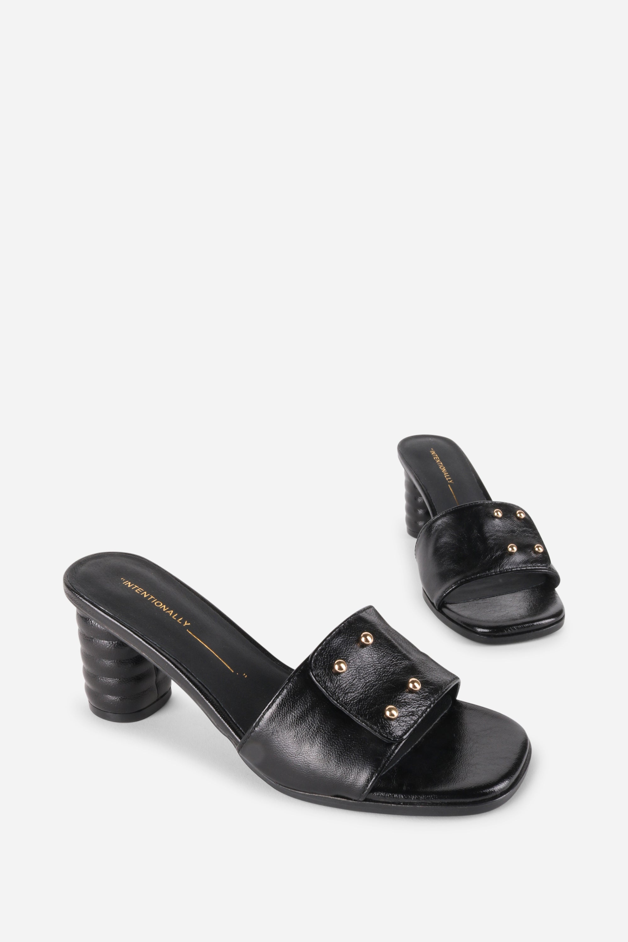 INTENTIONALLY __________. Kizmit Mule Heels