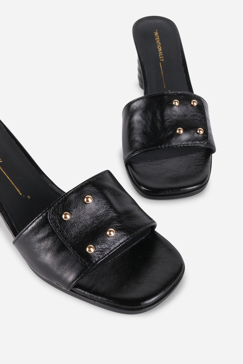 INTENTIONALLY __________. Kizmit Mule Heels