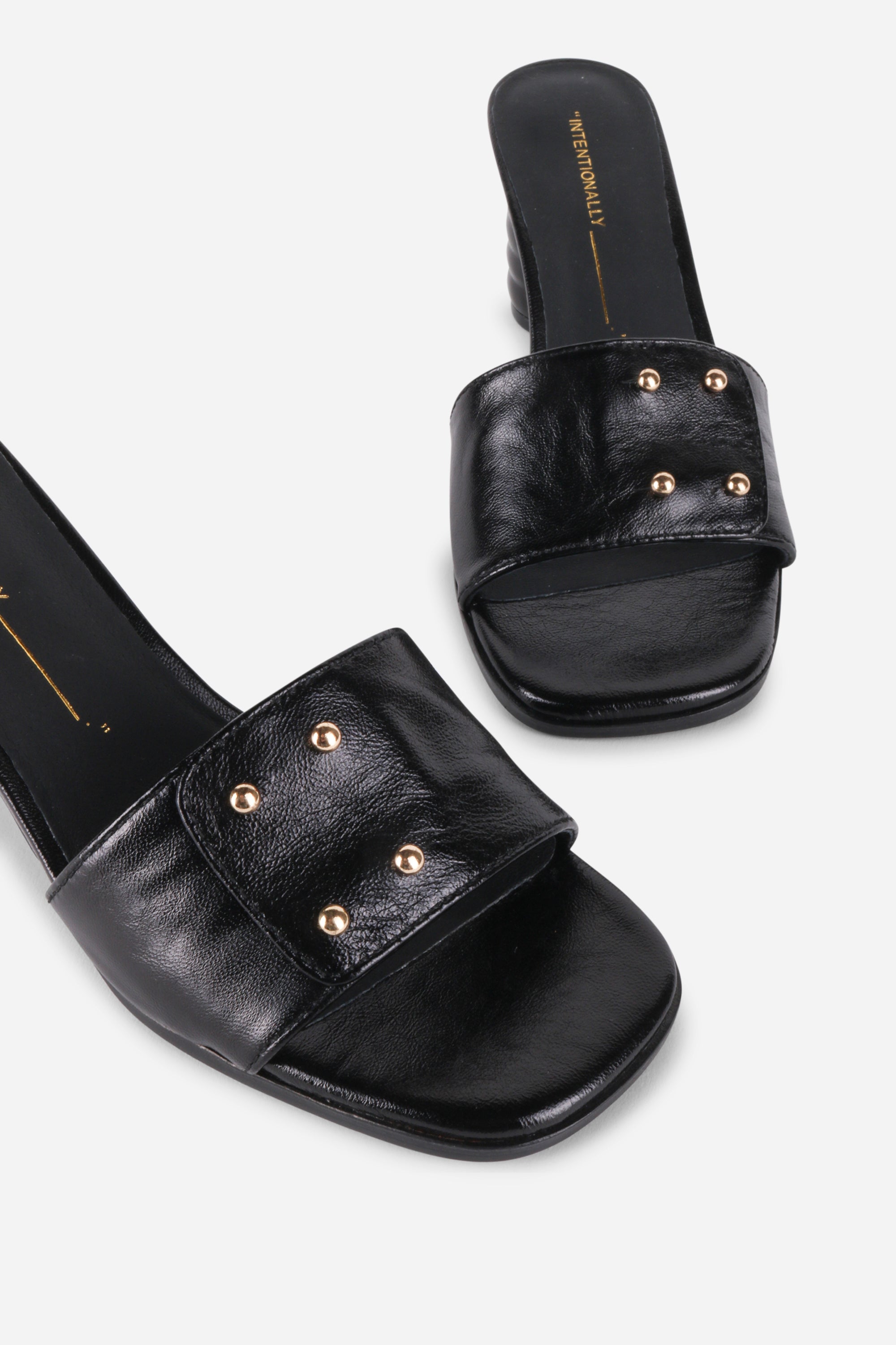 INTENTIONALLY __________. Kizmit Mule Heels