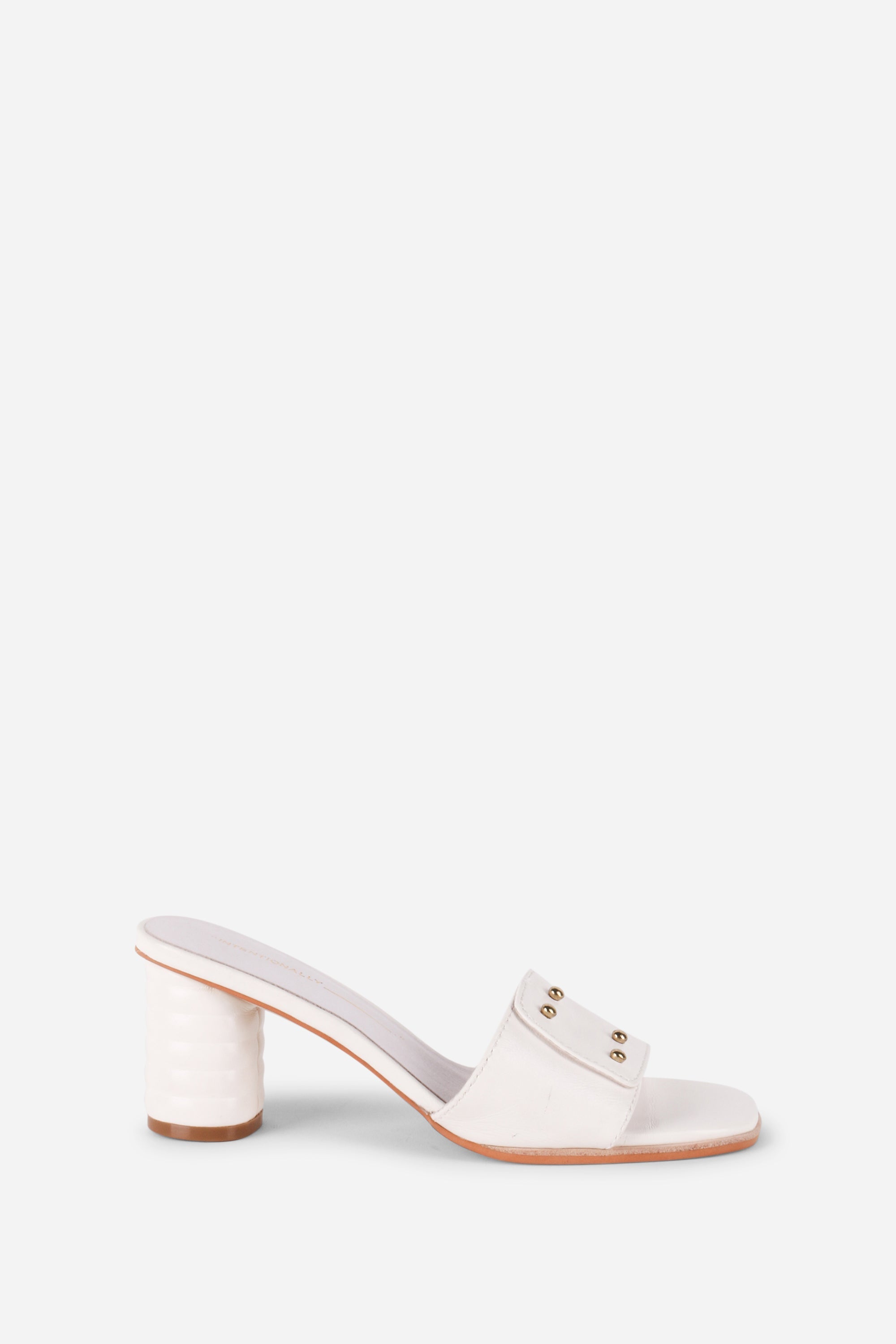 INTENTIONALLY __________. Kizmit Mule Heels