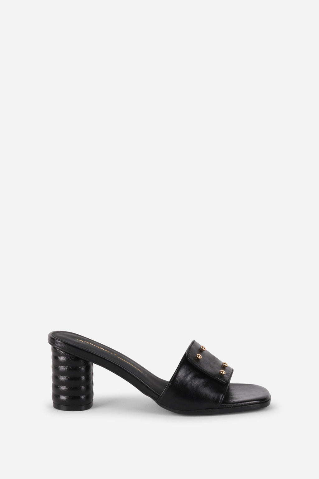 INTENTIONALLY __________. Kizmit Mule Heels